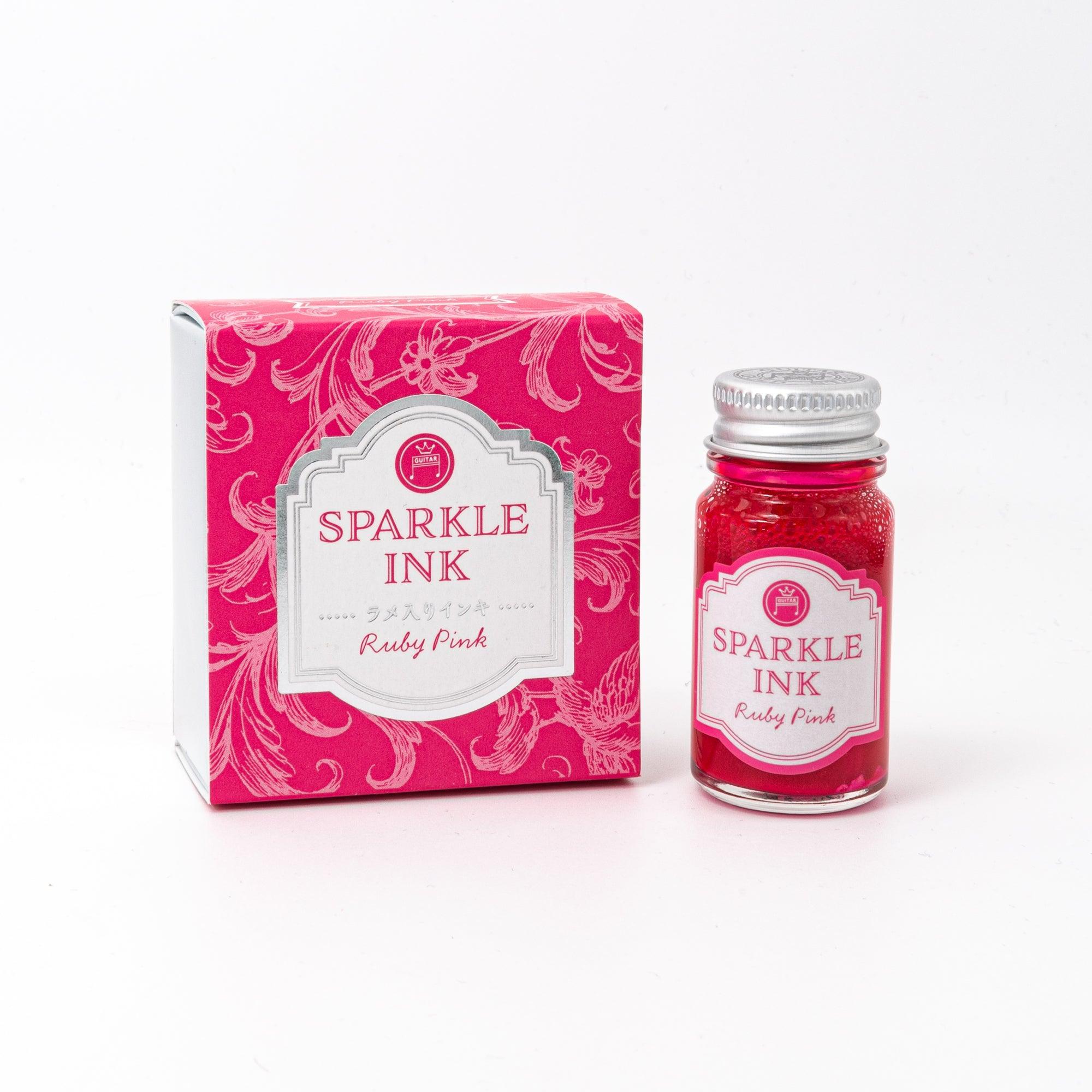 Sparkle Ink in Ruby Pink, packaged in a glass bottle with matching pink box, featuring elegant floral designs and stylish typography.