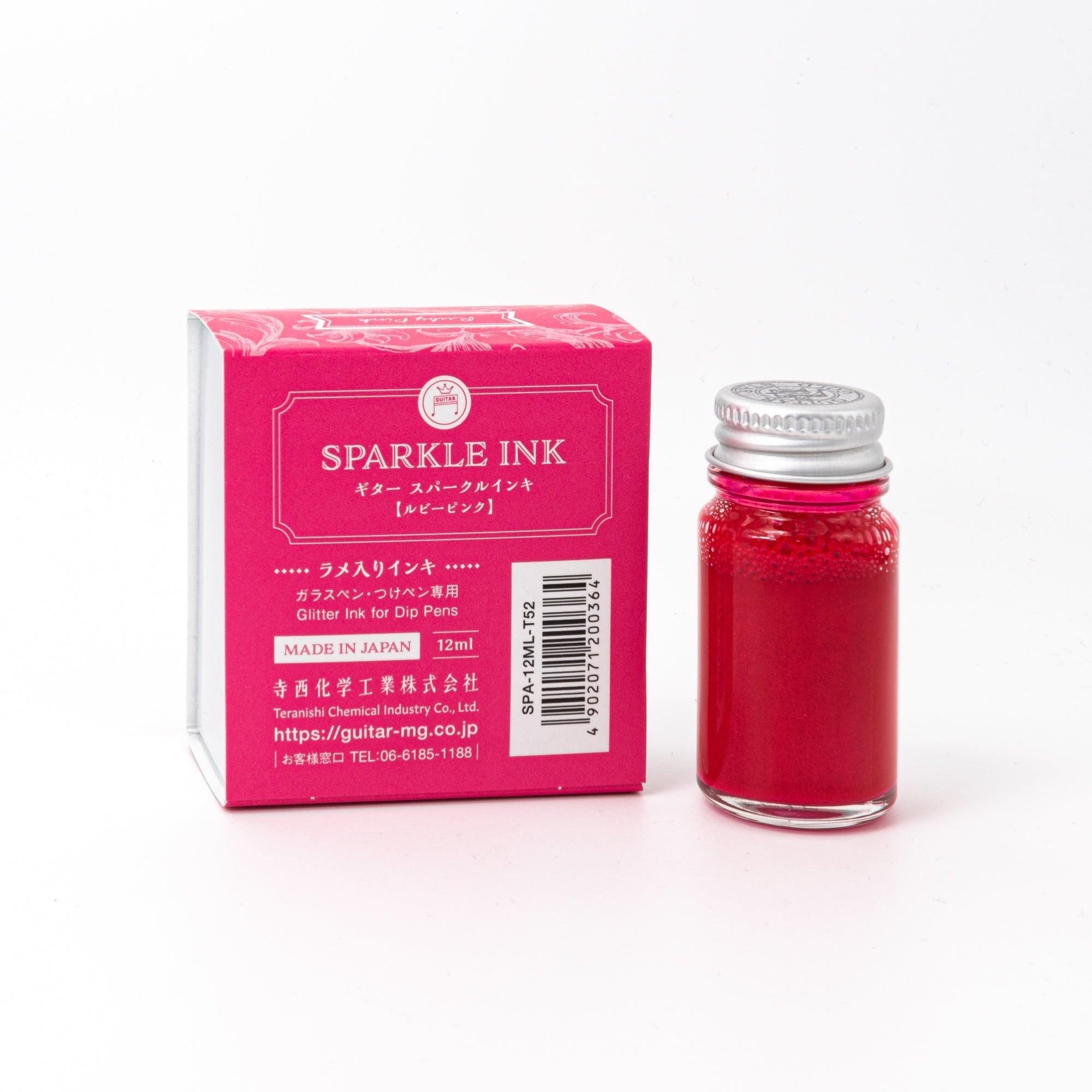 Sparkle Ink in Ruby Pink, packaged in a glass bottle with matching pink box, featuring elegant floral designs and stylish typography.