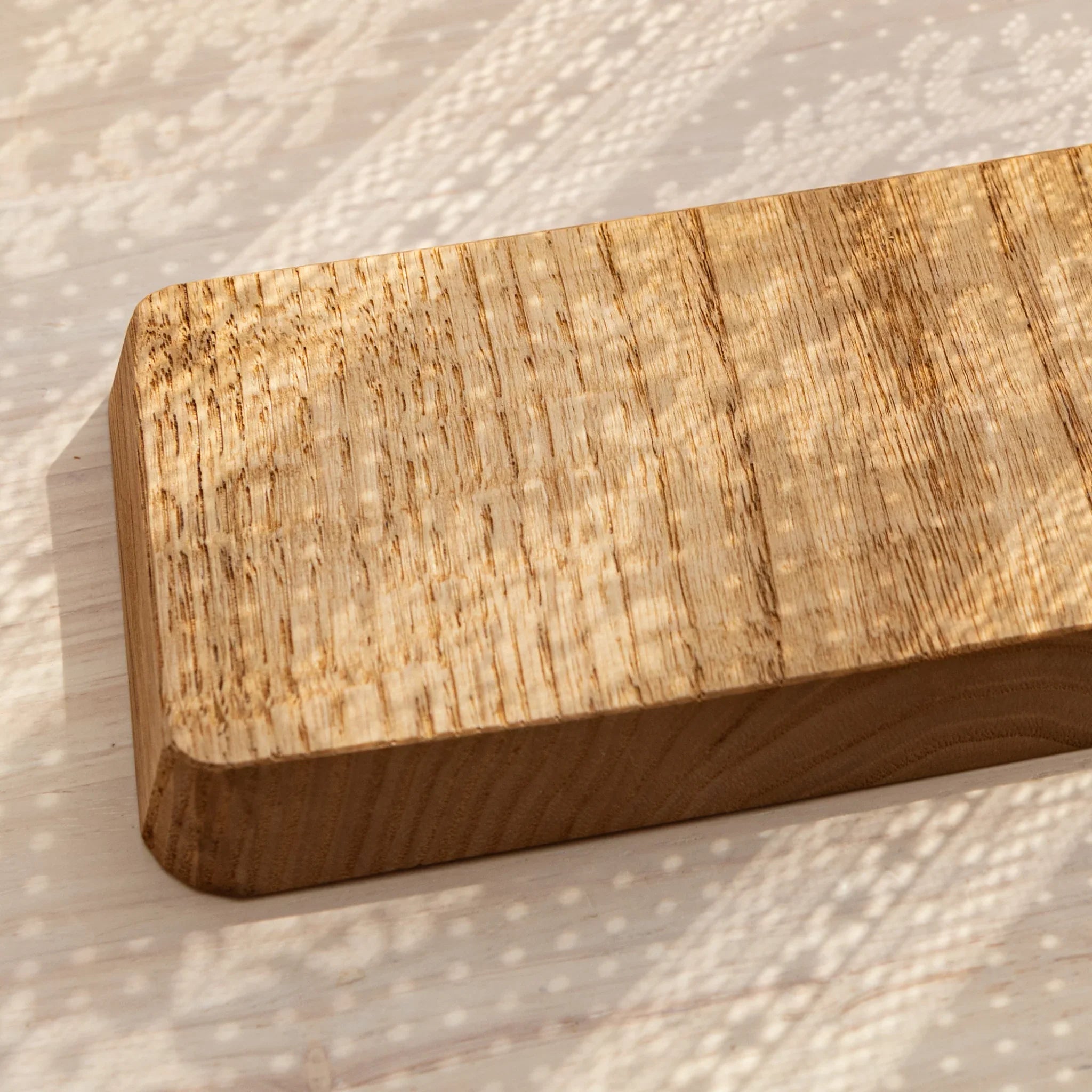 Light wood pen tray detail showing groove carving quality and craftsmanship displayed clearly composition