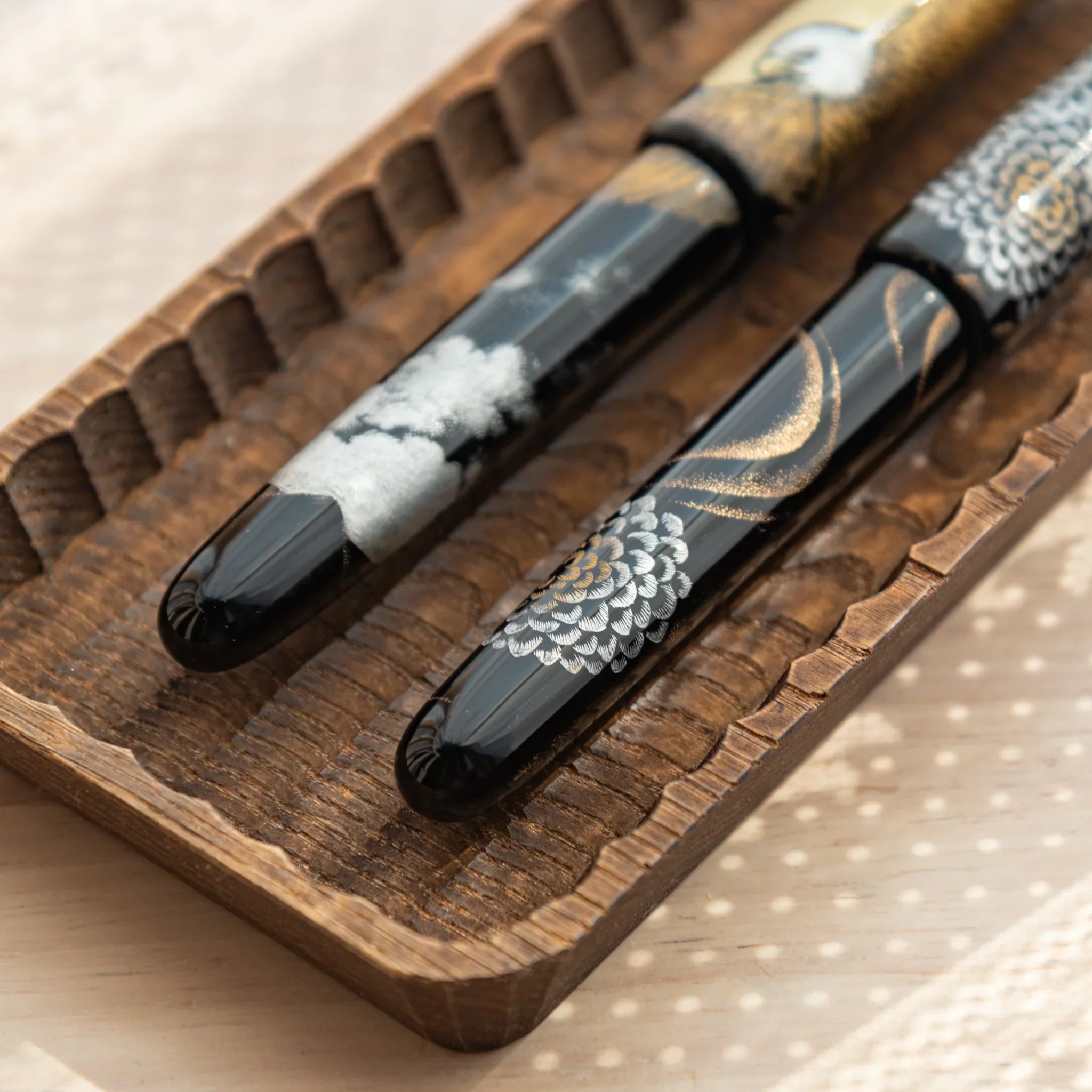 Wagatabon tray with pens positioned showing functional design structure displayed clearly with precise carving detail