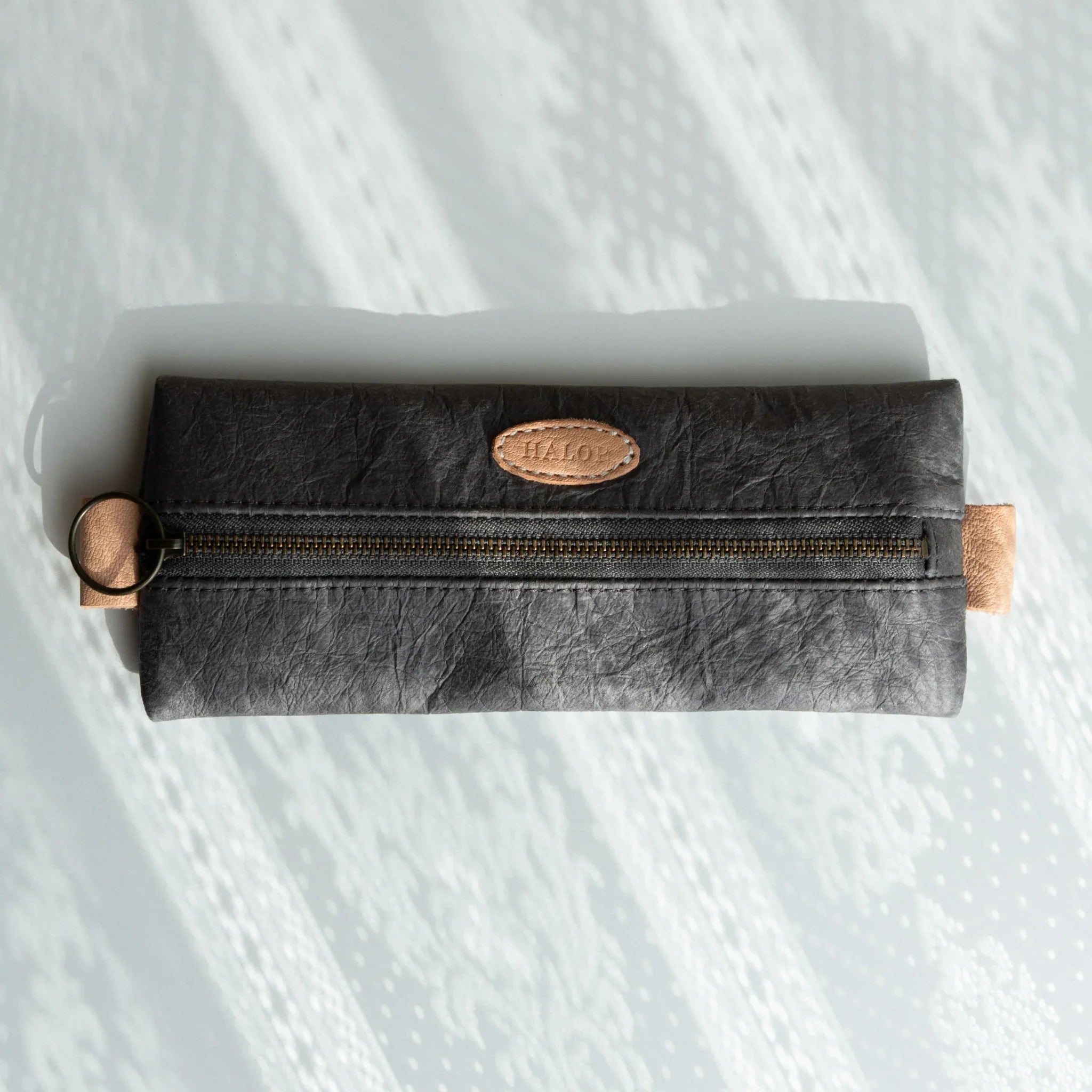 Handcrafted Sugihara washi paper pen case in gray with traditional finish displayed clearly composition
