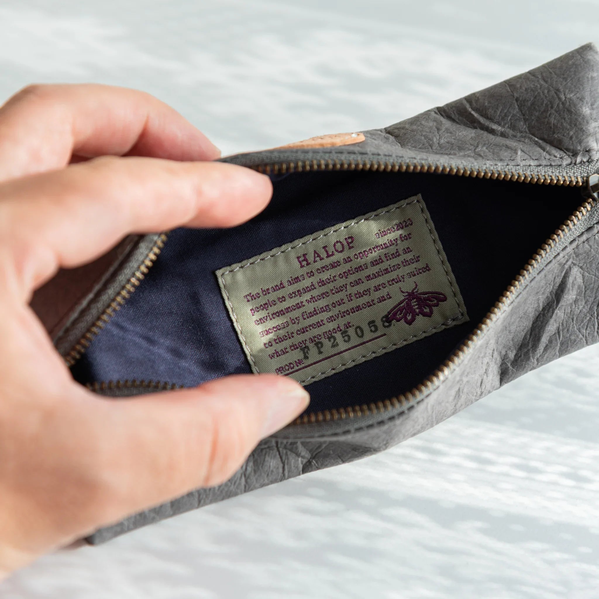 Sugihara washi pen case in gray tone with visible paper grain texture displayed clearly with hand-dyed finish