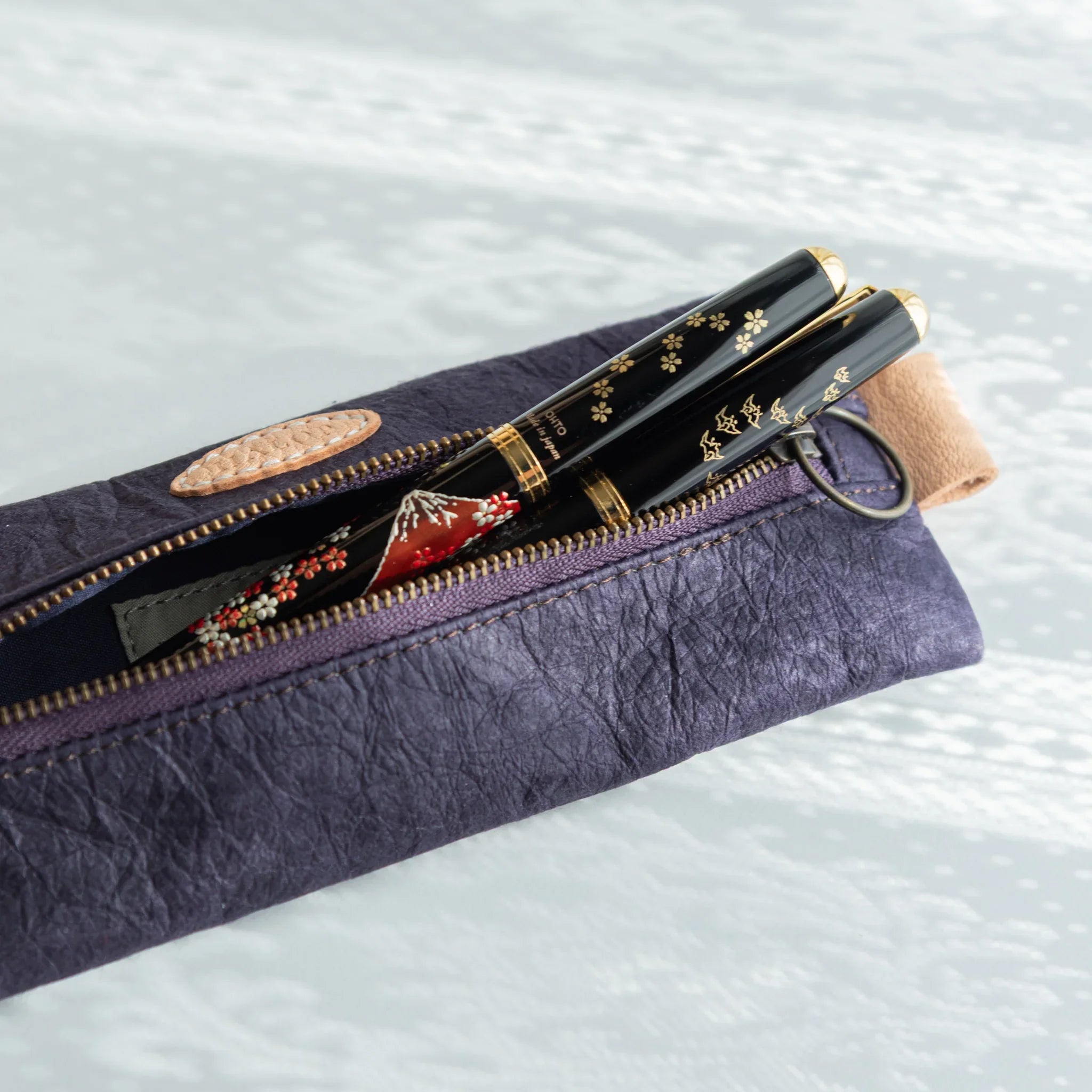 Purple Sugihara pen case displayed from three-quarter angle view displayed clearly with traditional construction