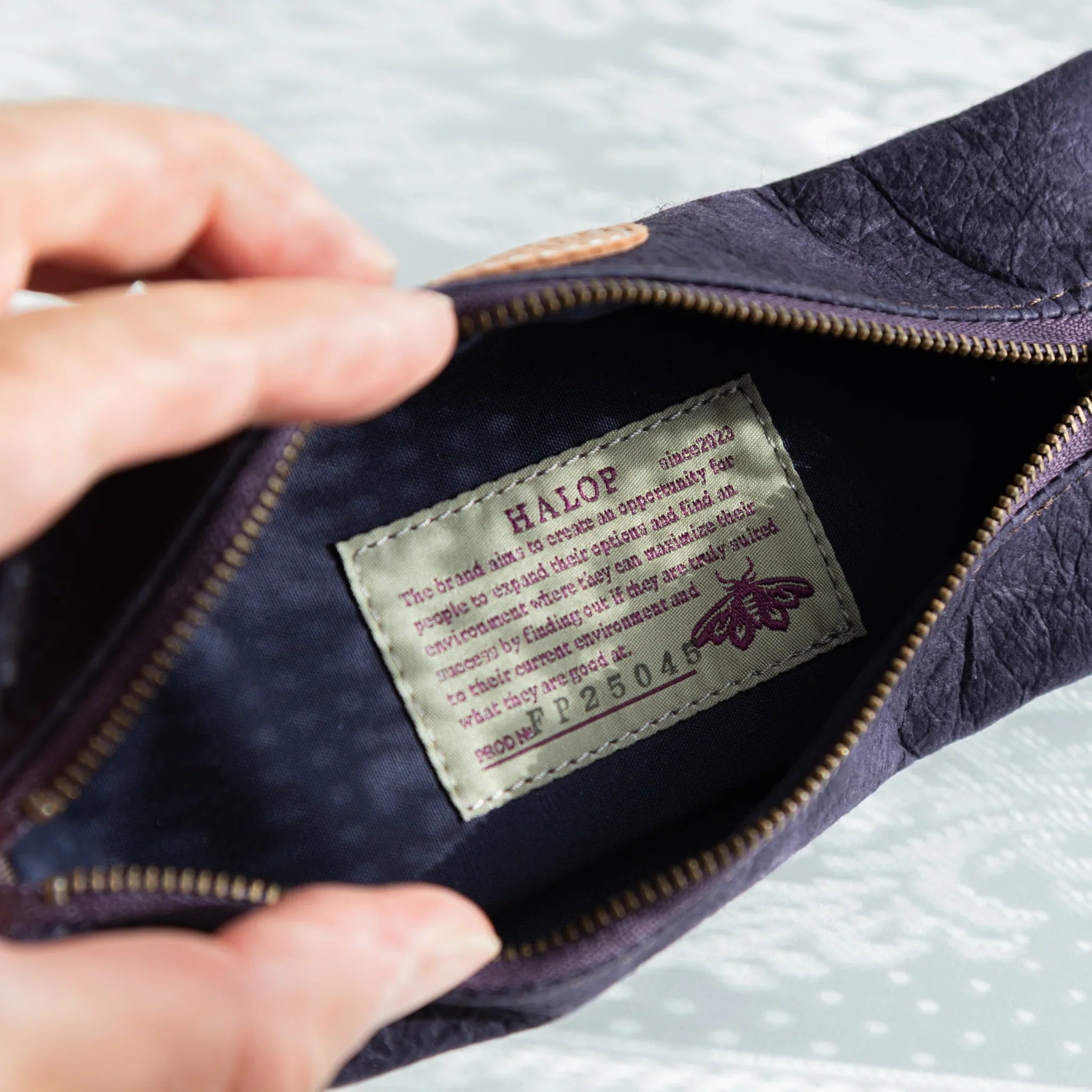 Purple pen case detail showing handcrafted washi paper construction method displayed clearly composition