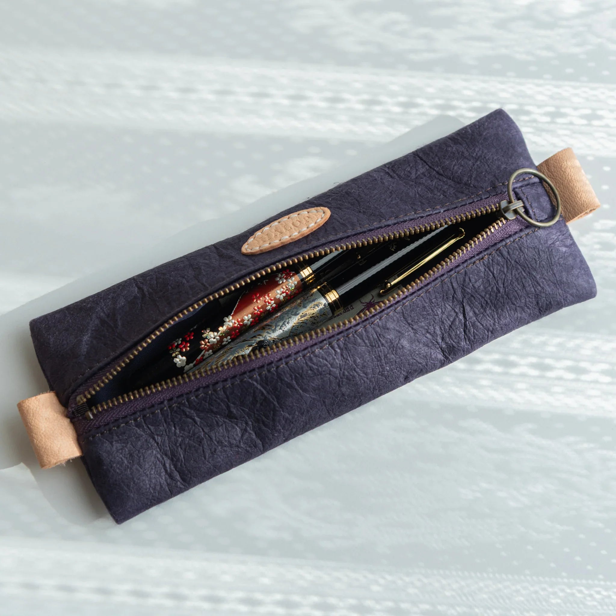 Handcrafted purple Japanese Pen Case holding two Japanese Fountain Pens with lacquer design, blending elegance and craft.