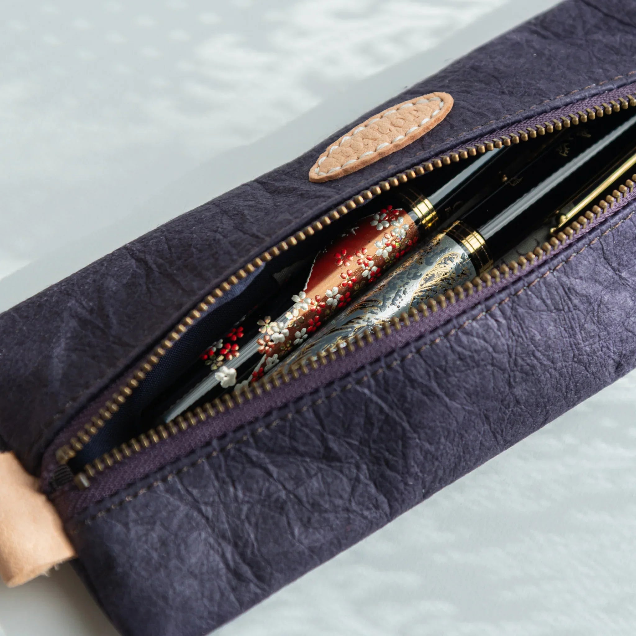 Sugihara washi paper case detail showing paper texture and construction on roll in composition composition