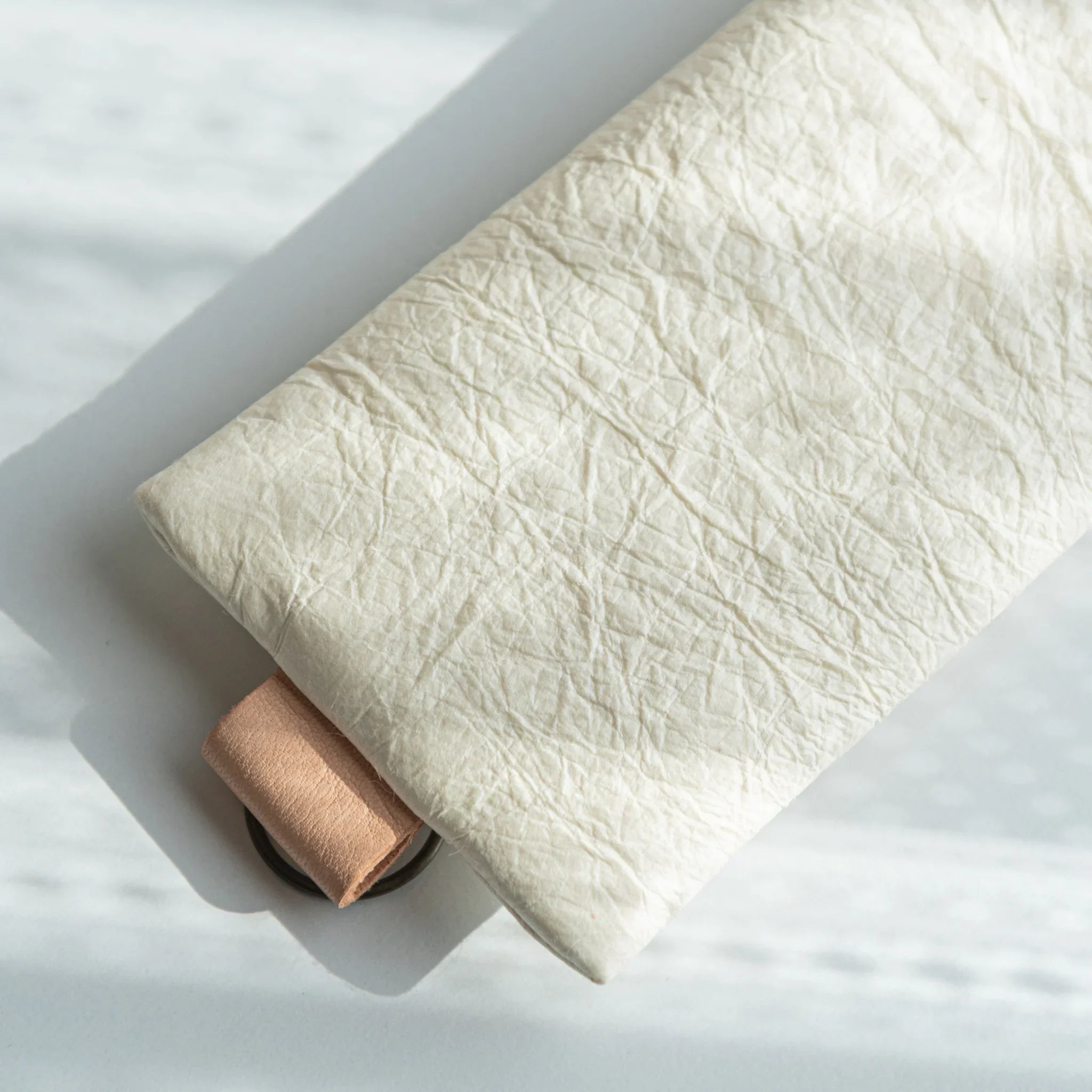 Handcrafted Sugihara Washi Paper Pen Case white tilted angle view showing washi paper and wood edge detail