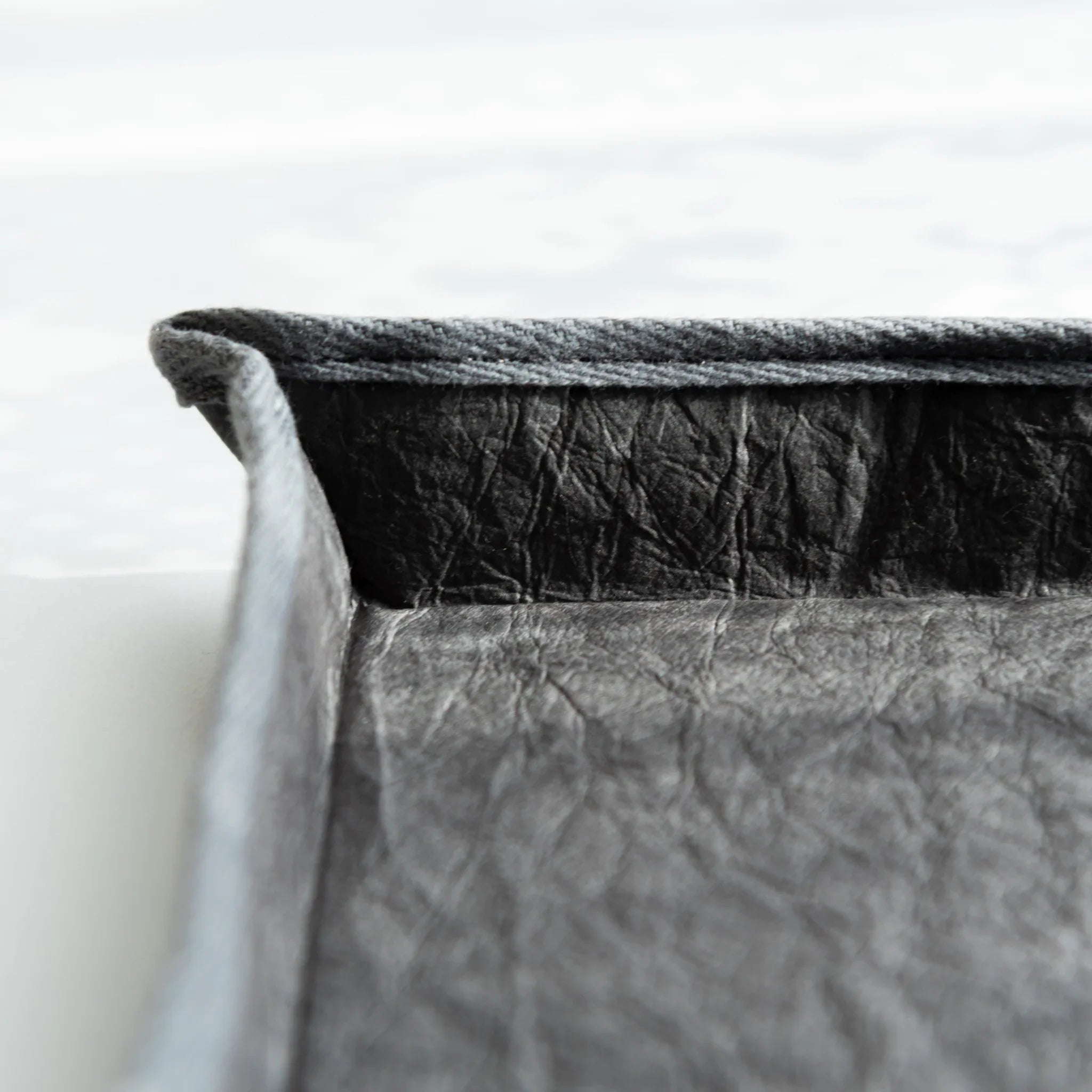 Detailed view of Japanese Pen Tray edge, reinforced with cloth stitching that highlights the craftsmanship of washi.