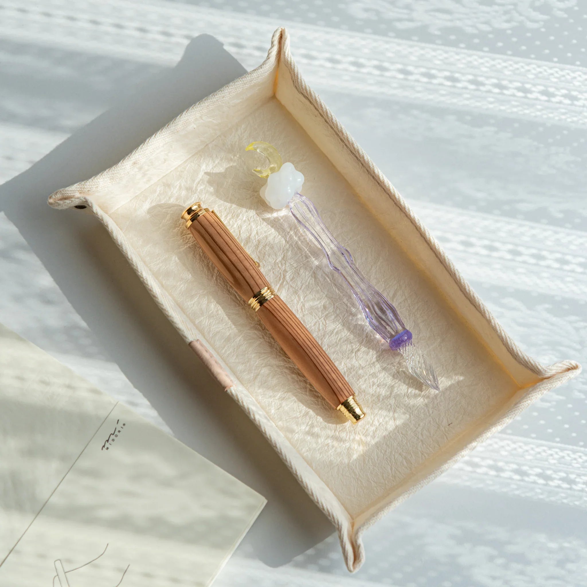 Japanese Pen Tray – White holding two lacquered Japanese Fountain Pens, combining refined craft and elegant functionality.
