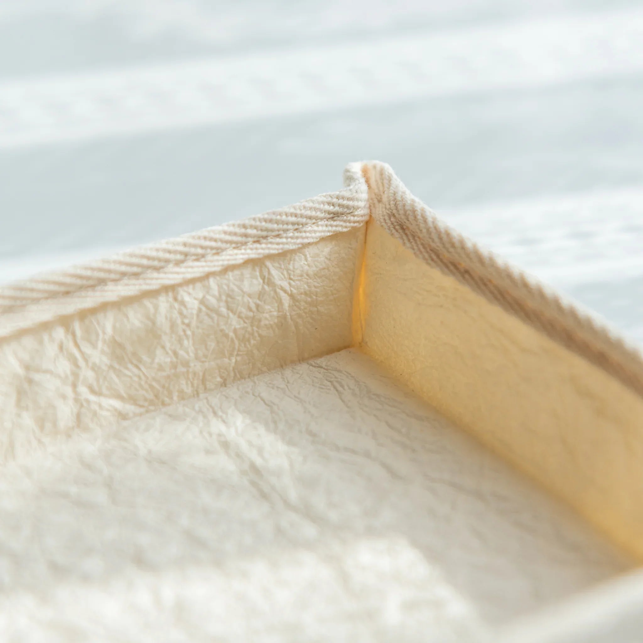Detailed view of Japanese Pen Tray edge, reinforced with cloth stitching that highlights the craftsmanship of washi.