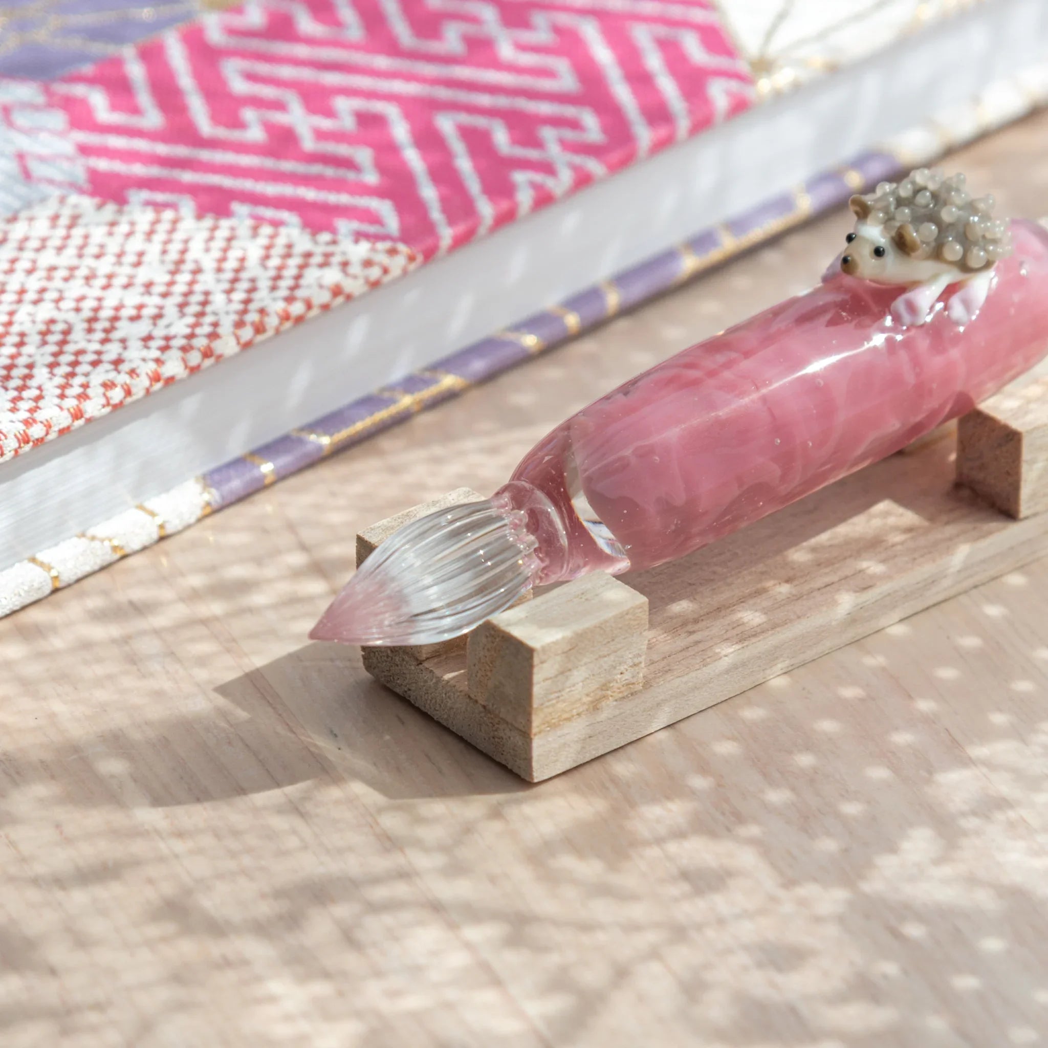 Charming hedgehog glass dip pen combining woodland character with colored glass ink vial with unique design