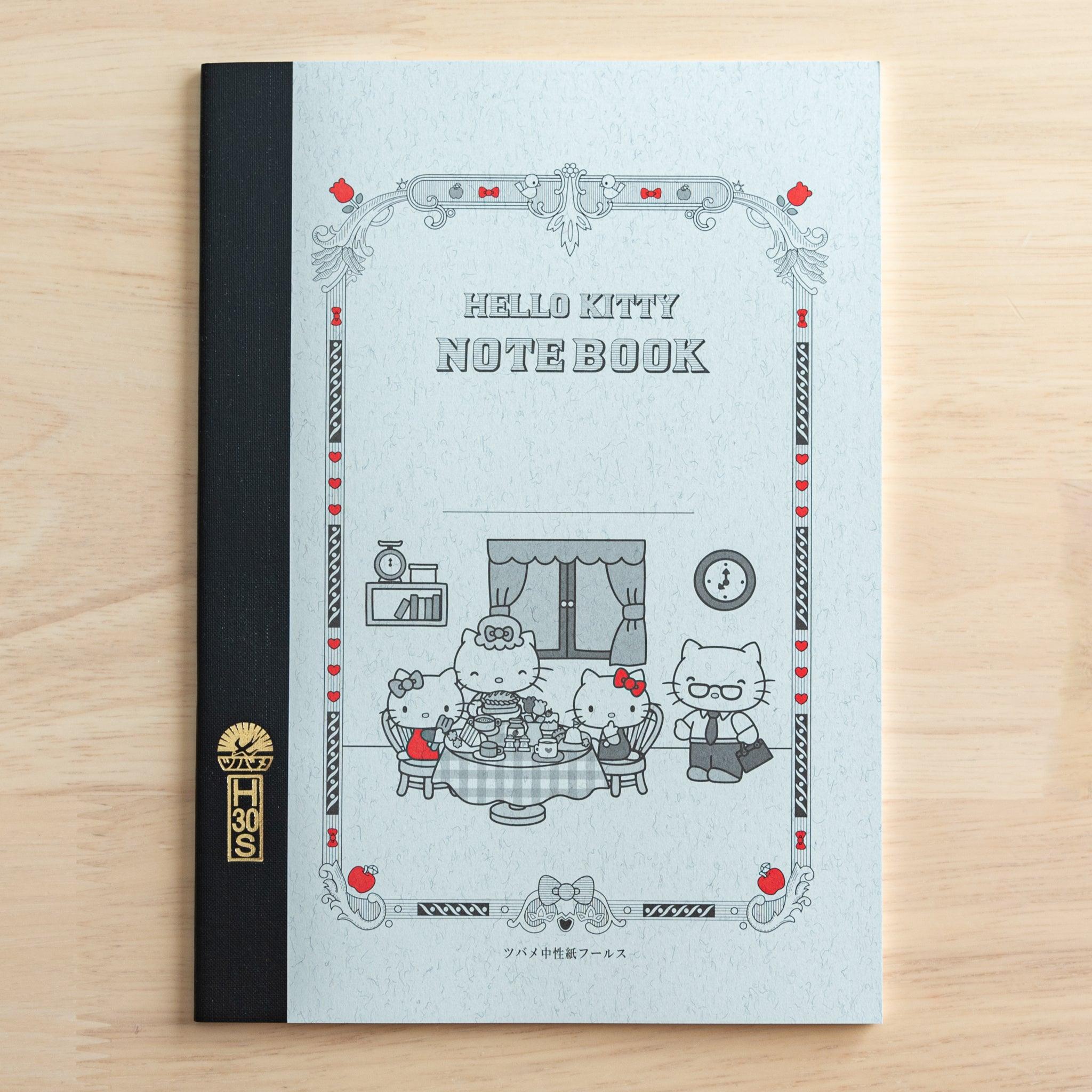 A Tsubame Japanese notebook featuring a Hello Kitty design, with an ornate cover, black spine, and red accents, blending classic Japanese stationery with a cute aesthetic.