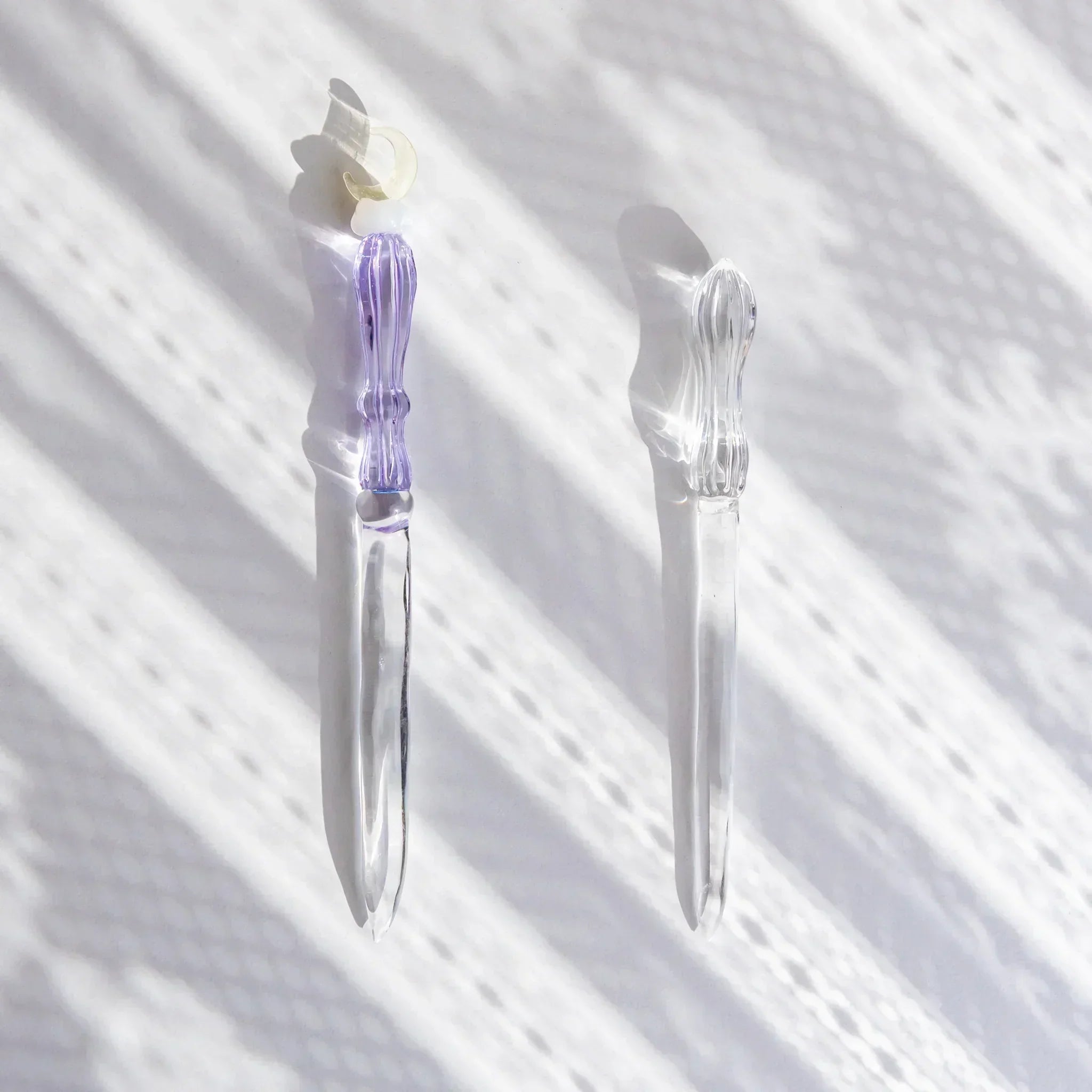 Moonlit cloud glass letter opener with lavender tint shown in composition shown composition product composition view