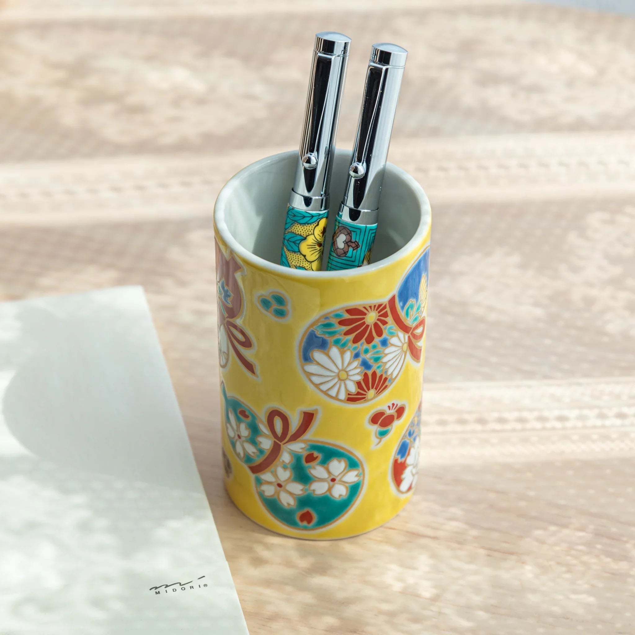 Gourd-shaped Kutani ceramic pen holder featuring traditional hand-painted design and gold for refined desk organization