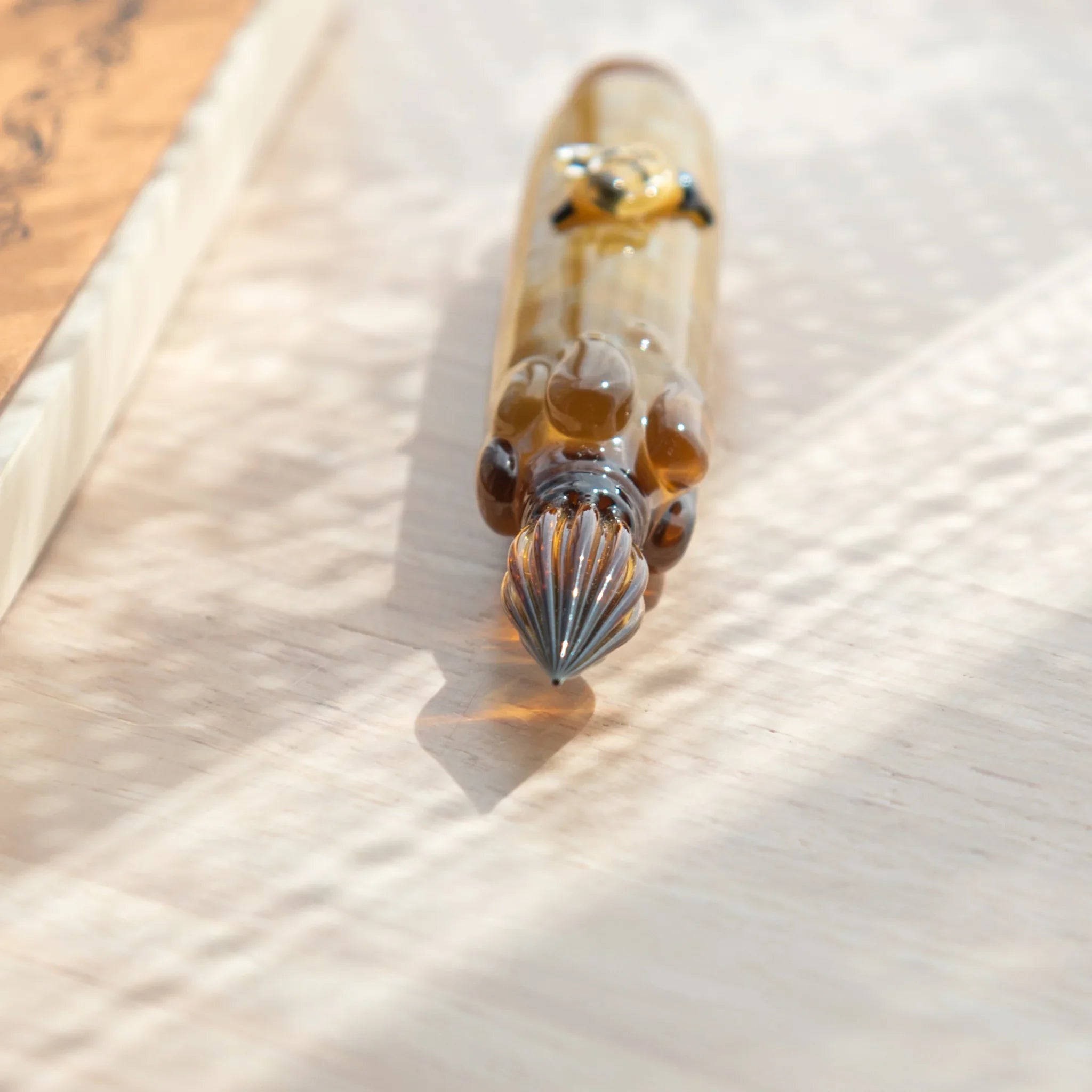 Delightful honey bee glass dip pen combining garden character with colored glass ink vial with unique design