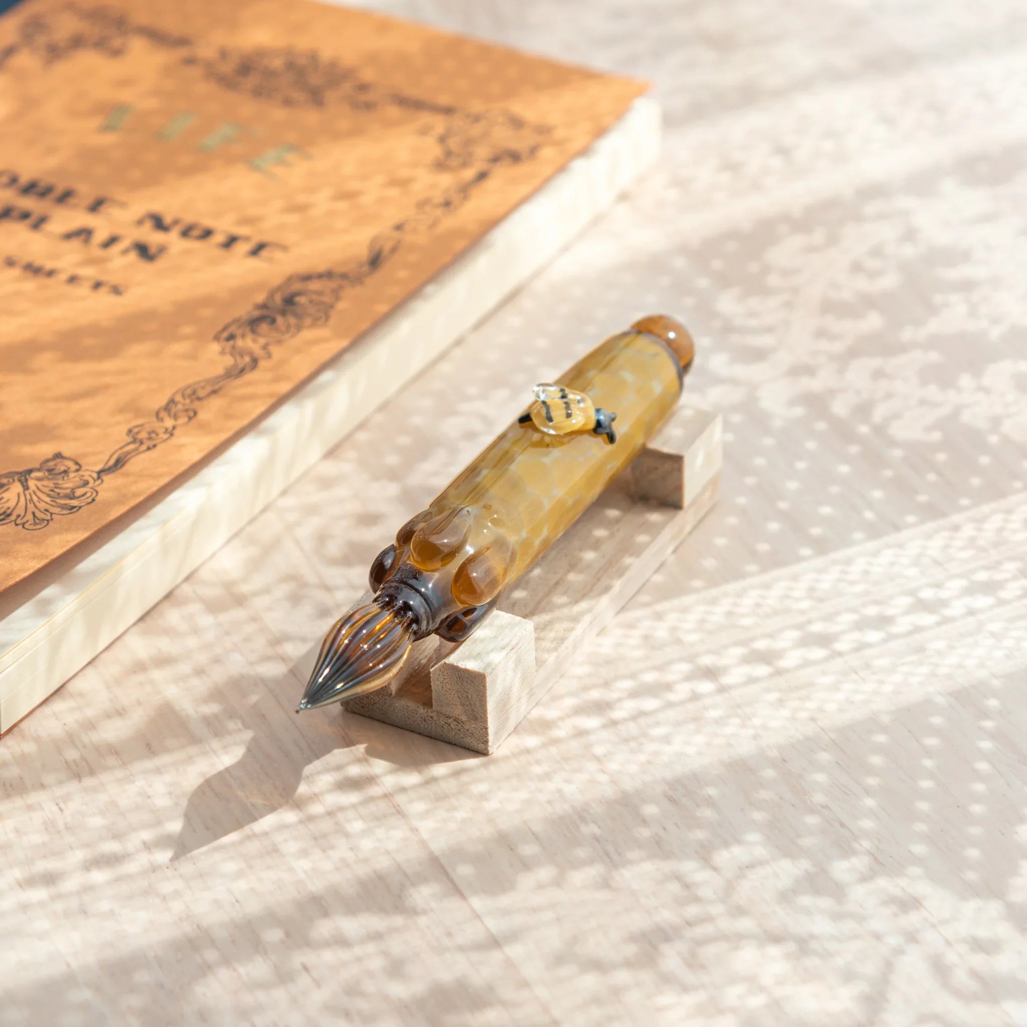 Charming honey bee glass dip pen featuring detailed bee ideal for unique nature-themed stationery with unique design
