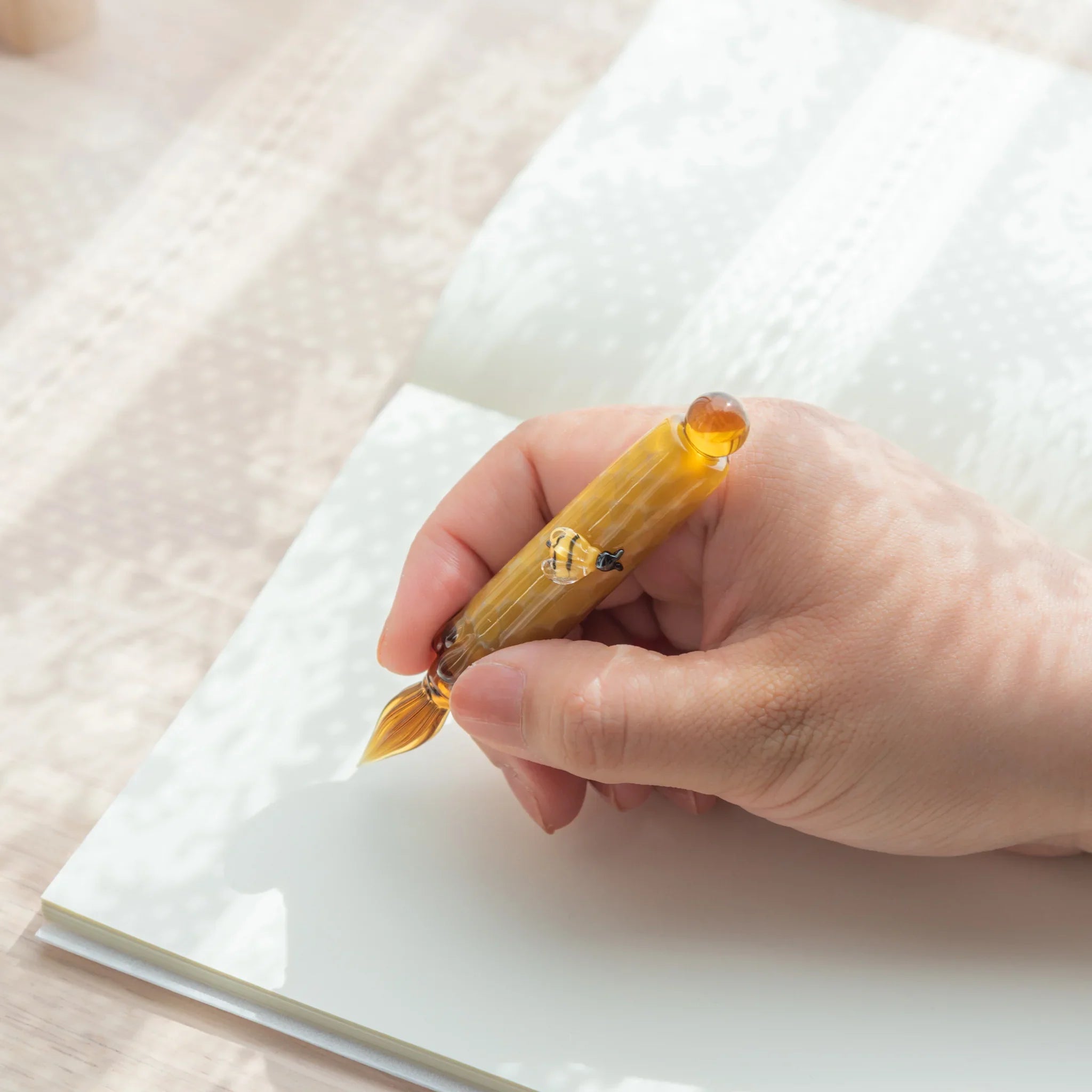 hand-made honey bee glass dip pen featuring adorable bee on glass barrel with wooden base with unique design