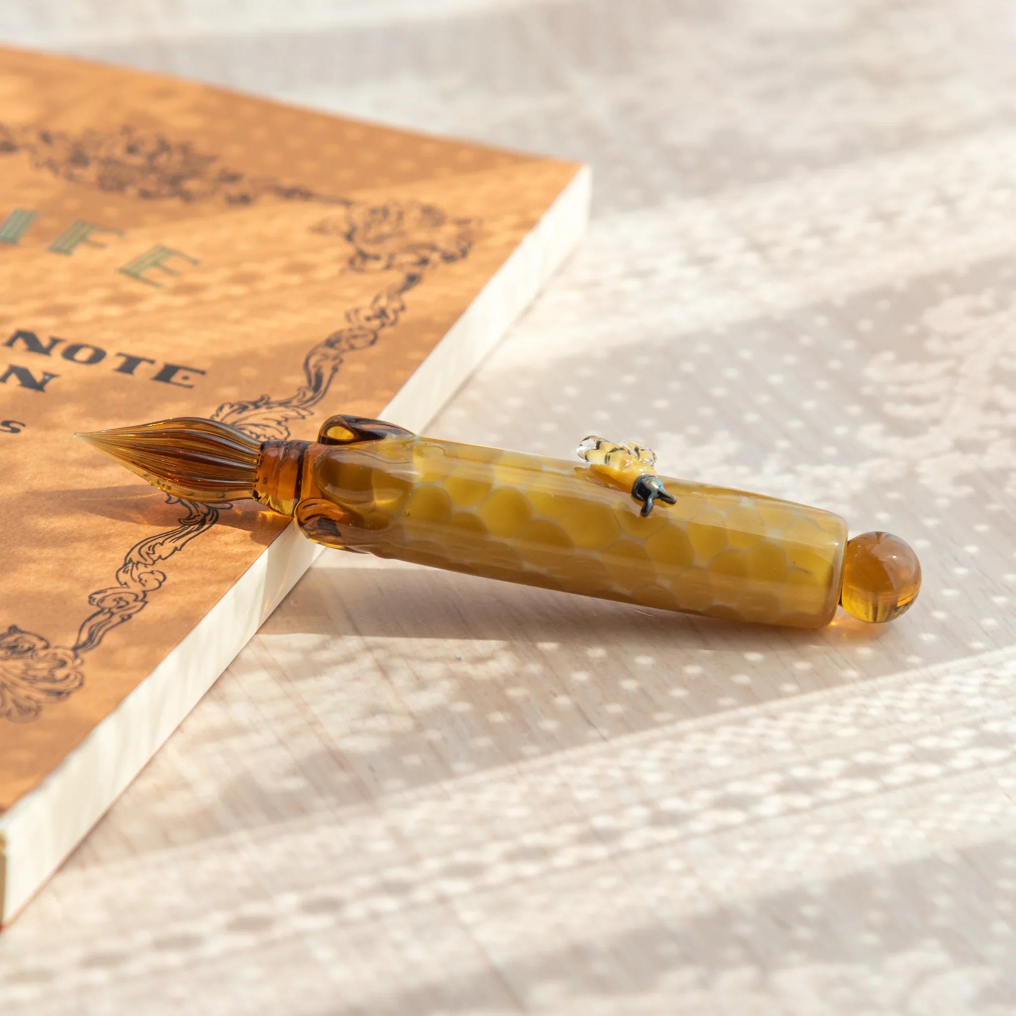 Unique honey bee glass dip pen combining cute resin creature with hand-poured glass barrel design with unique design