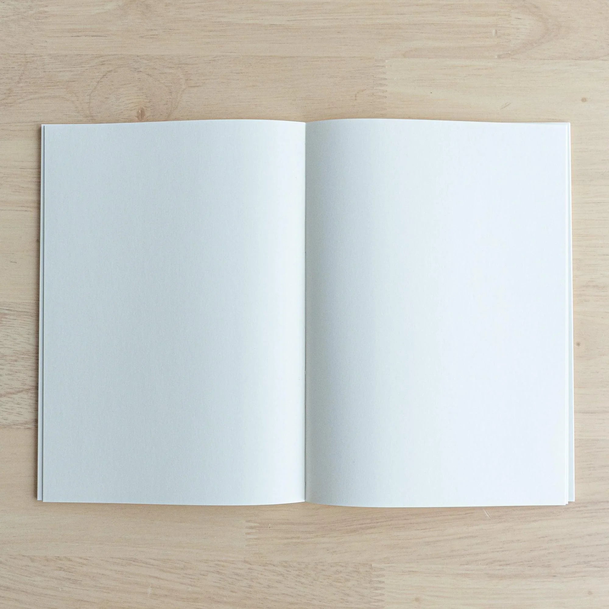 Japanese Iroful indigo A5 journal, tilted view emphasizing indigo dye depth and color richness throughout