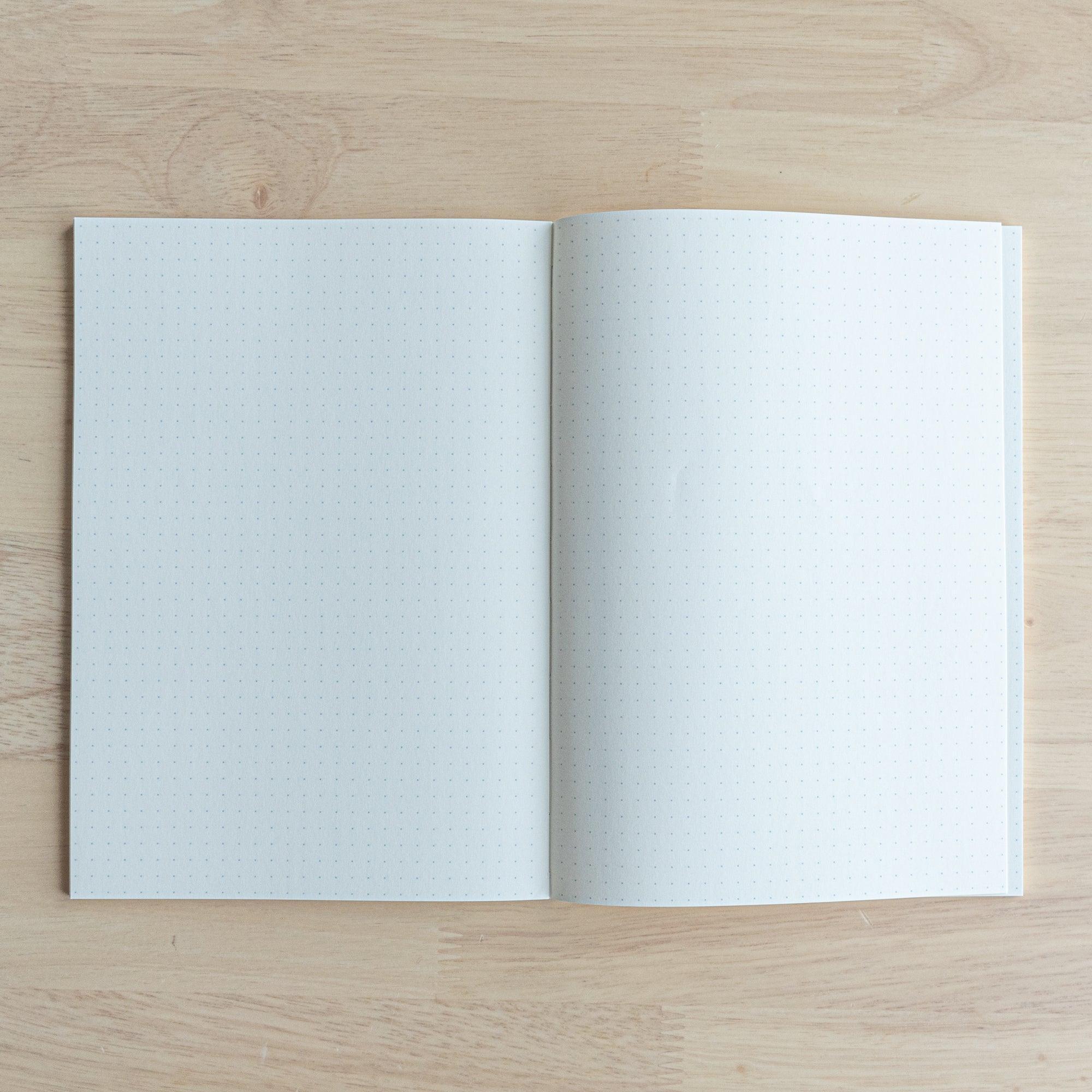 Iroful Japanese indigo A5 journal, angled side profile of spine and traditional Japanese binding detail