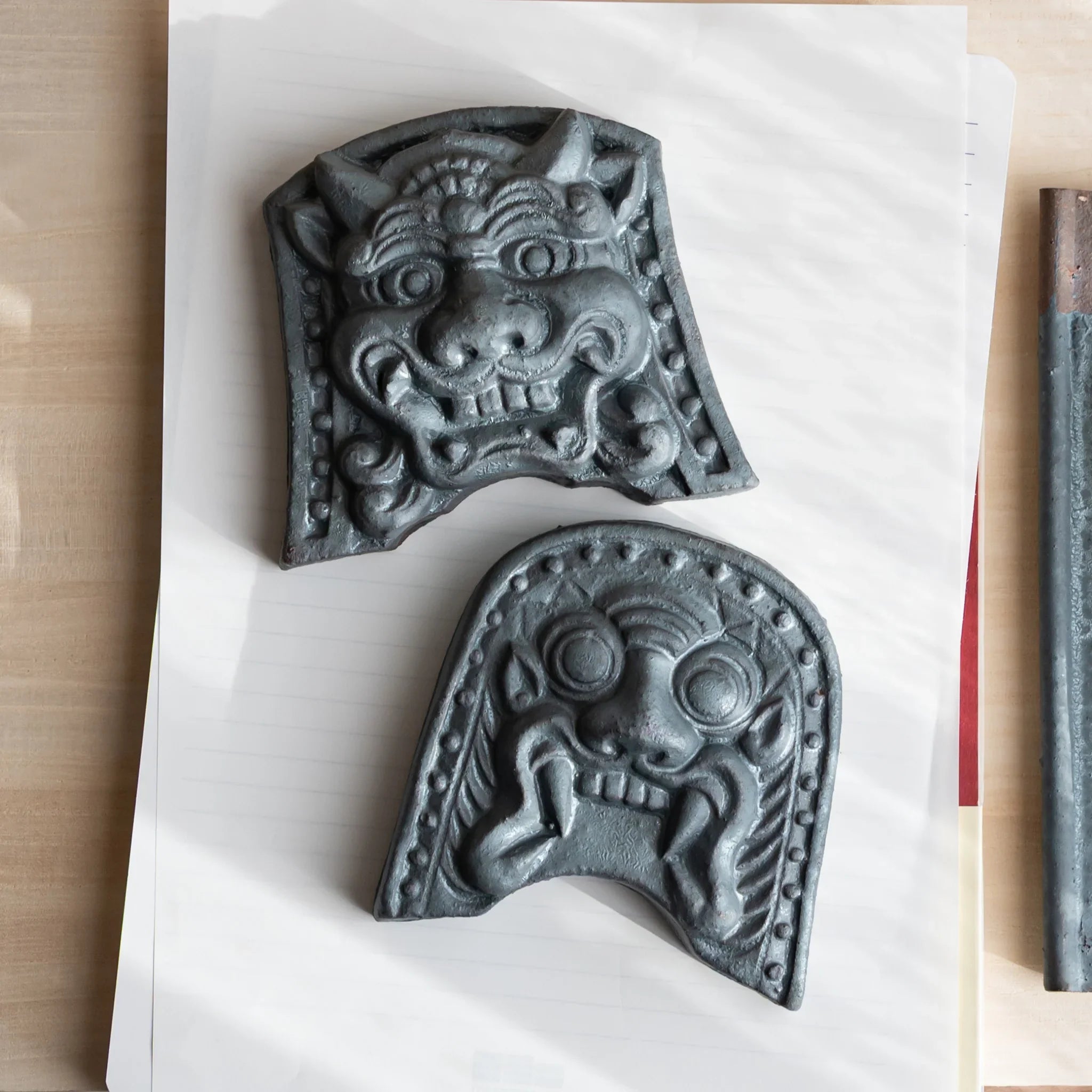 Japanese Kawara large roof guardian ceramic paperweight with steadfast expression shown displayed composition view