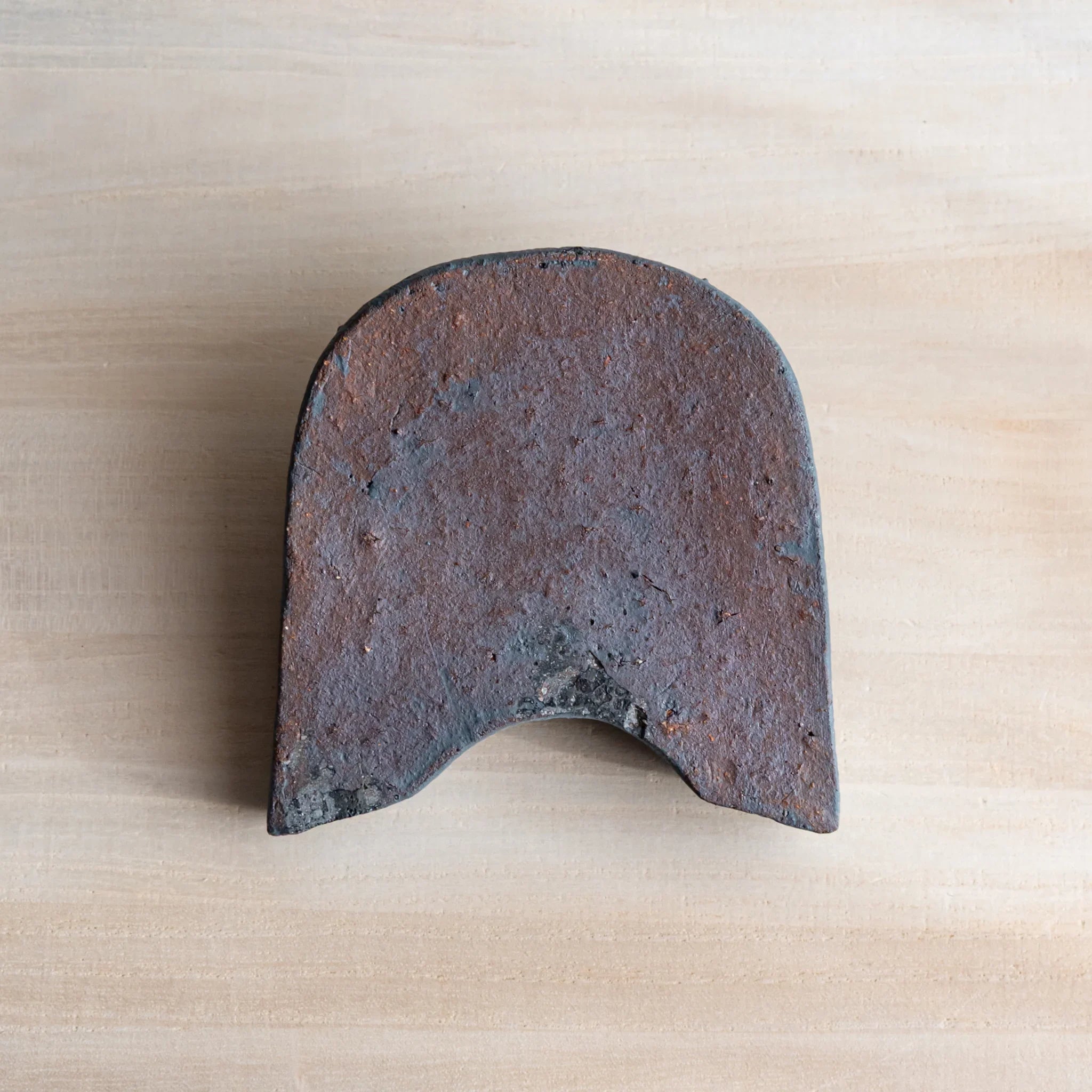 Japanese Kawara large roof guardian ceramic paperweight with steadfast expression shown shown view composition