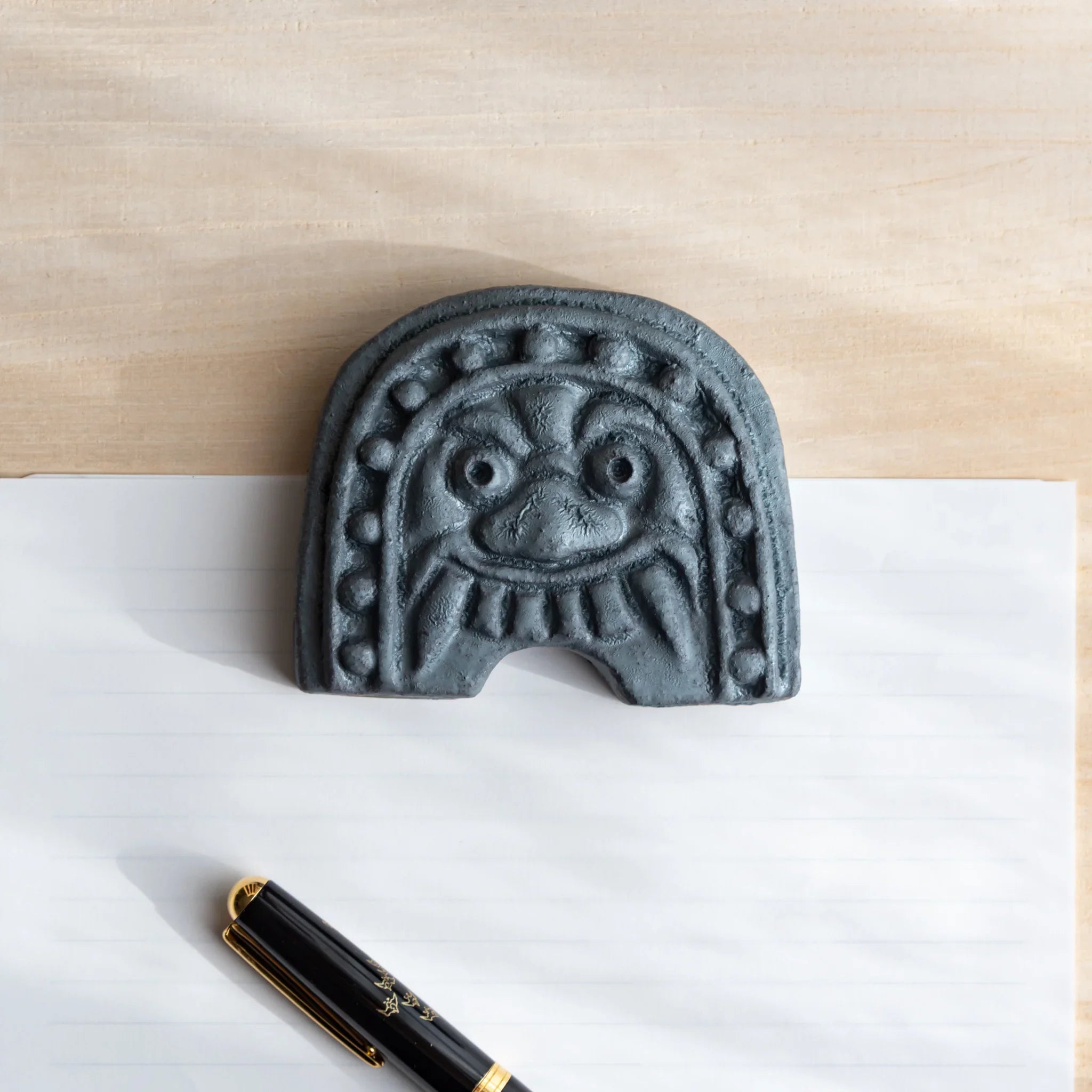 Japanese Kawara Roof Guardian Paperweight Medium rounded face front view showing guardian figure detail