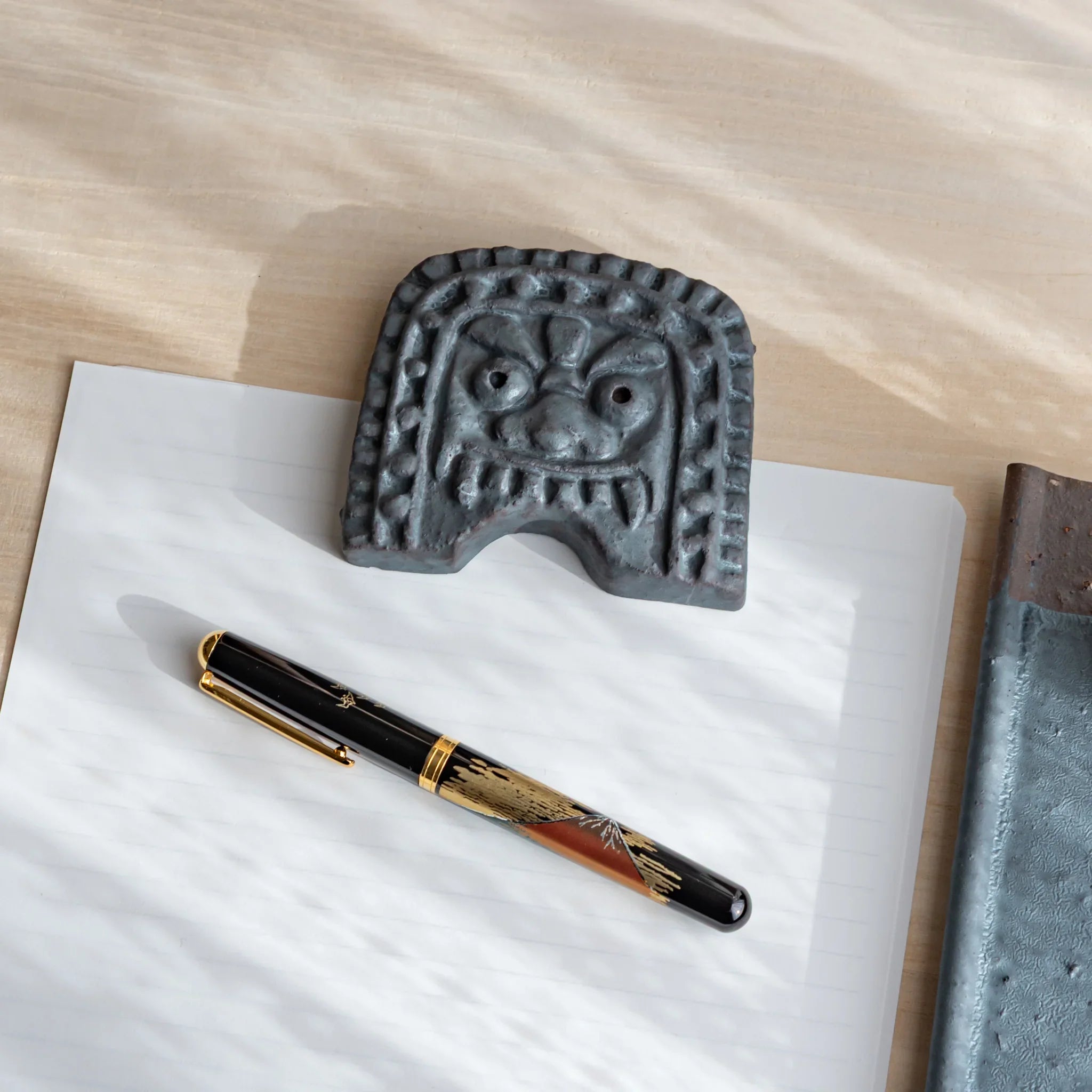 Japanese Kawara Roof Guardian Paperweight Medium square face angled view revealing sculpted facial feature