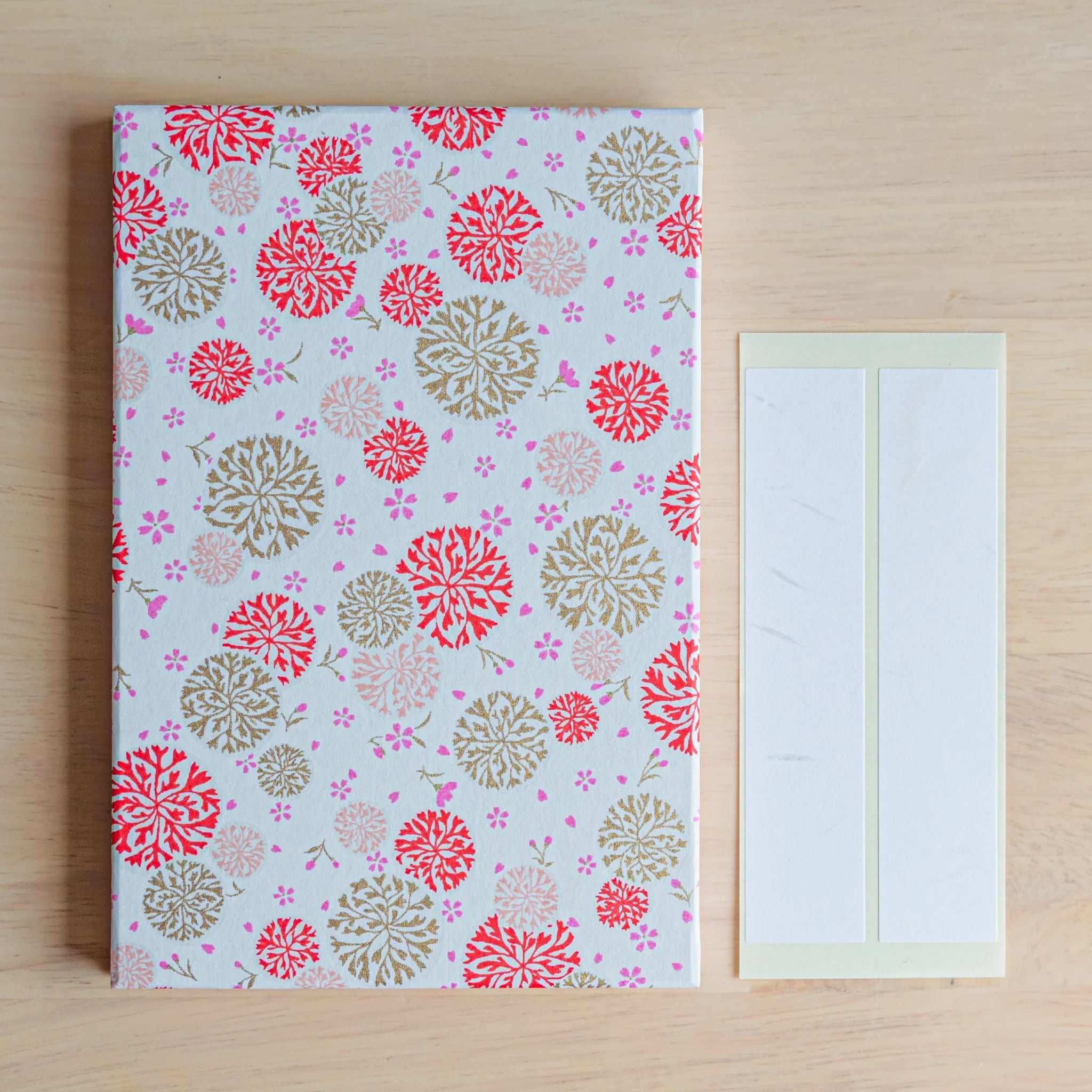 Kikka Harmony Washi Goshuincho Stamp Book Red angled view with detailed chrysanthemum pattern designs