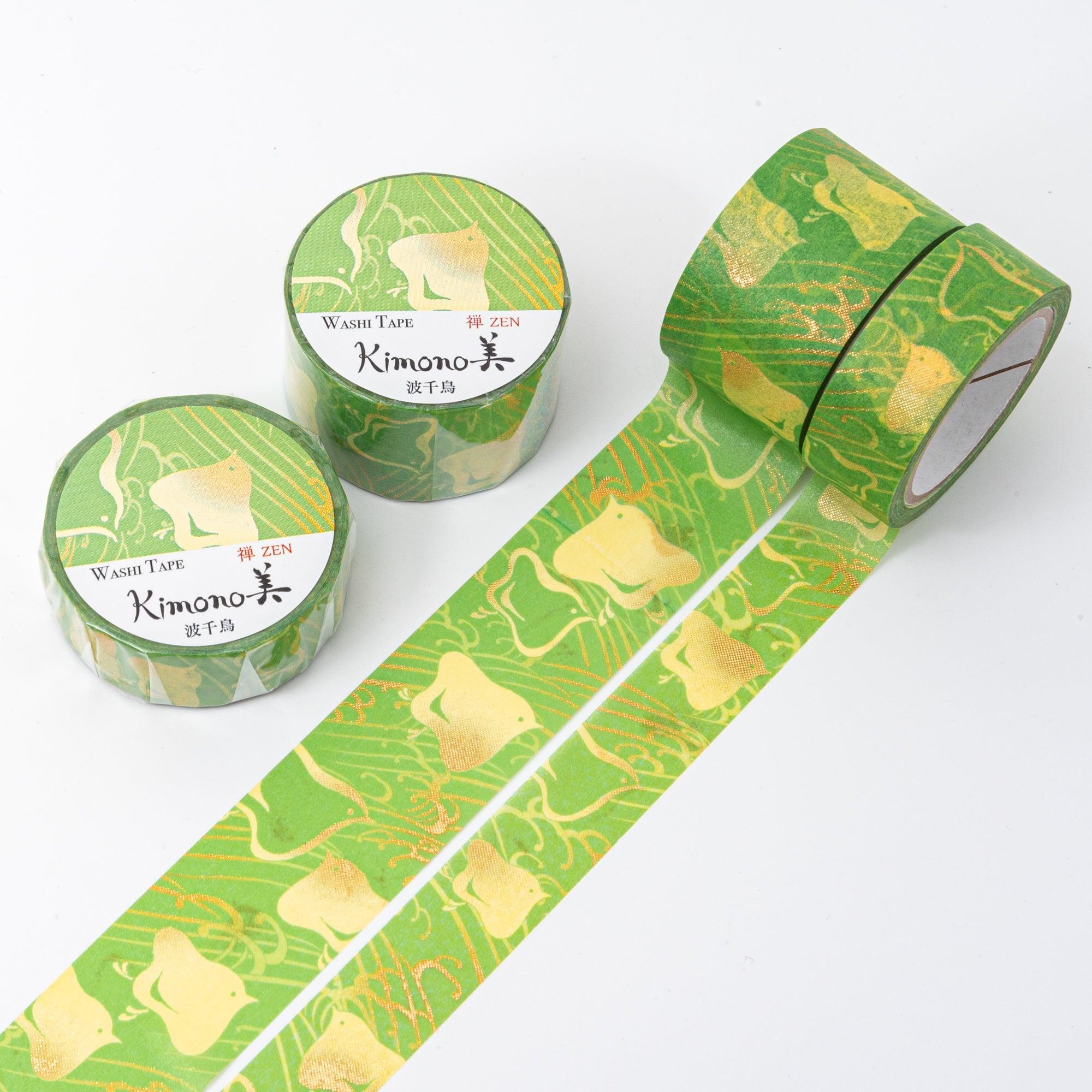 Two rolls of Japanese washi tape featuring abstract golden birds and swirling line patterns on a bright green background, with subtle metallic accents.