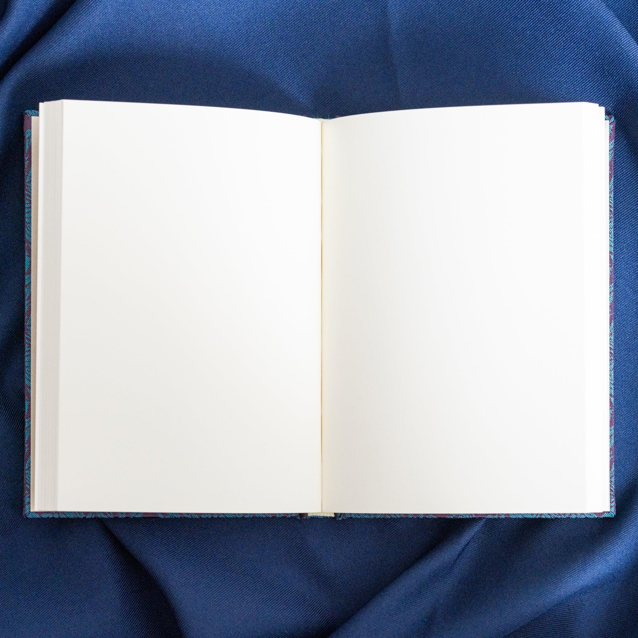 Kiri Take Ho-o Nishijin silk Homeicho notebook open flat view showing blank white pages on navy fabric background