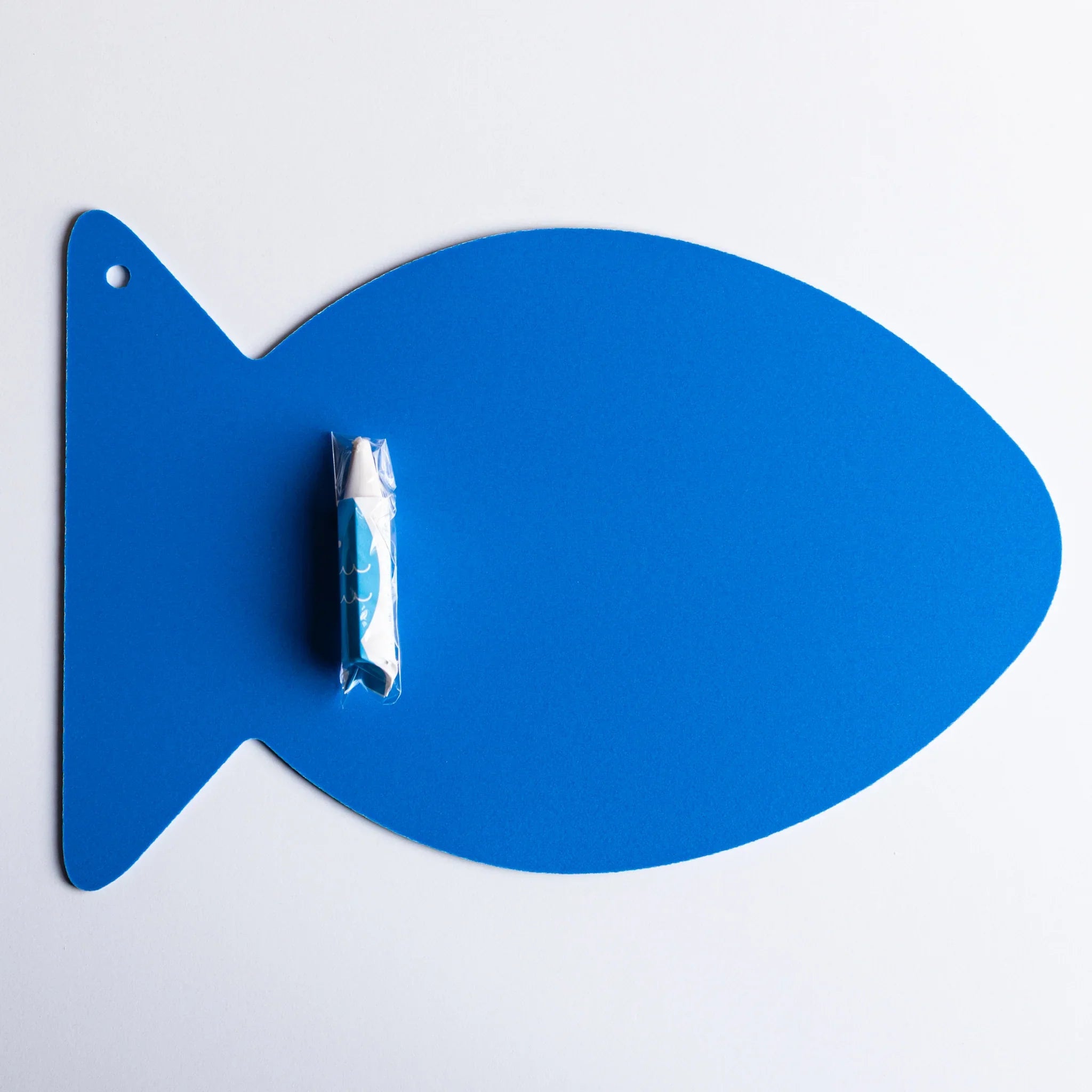 Fish-shaped drawing board with rounded edges and fins shown in overhead view and features and features
