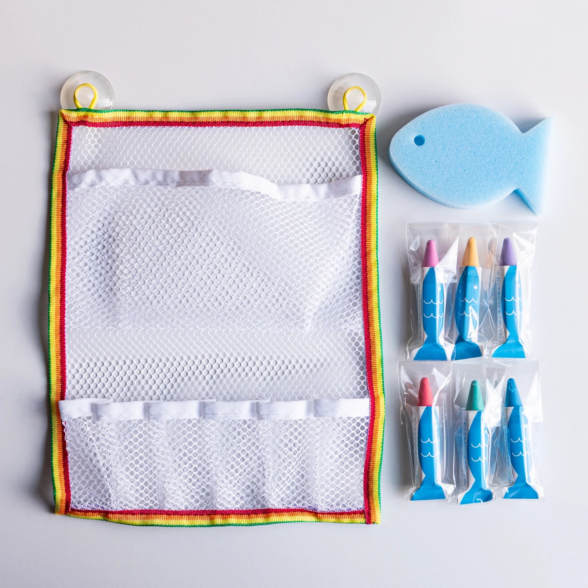 Kitpas crayon set packaging with blue mesh net visible showing contents product for creative bath time play