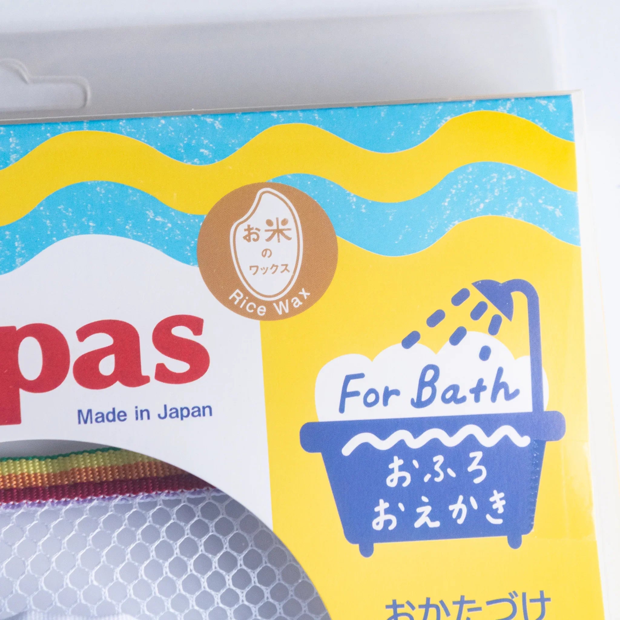 Kitpas crayons with blue mesh net and sponge in storage arrangement product for creative bath time play