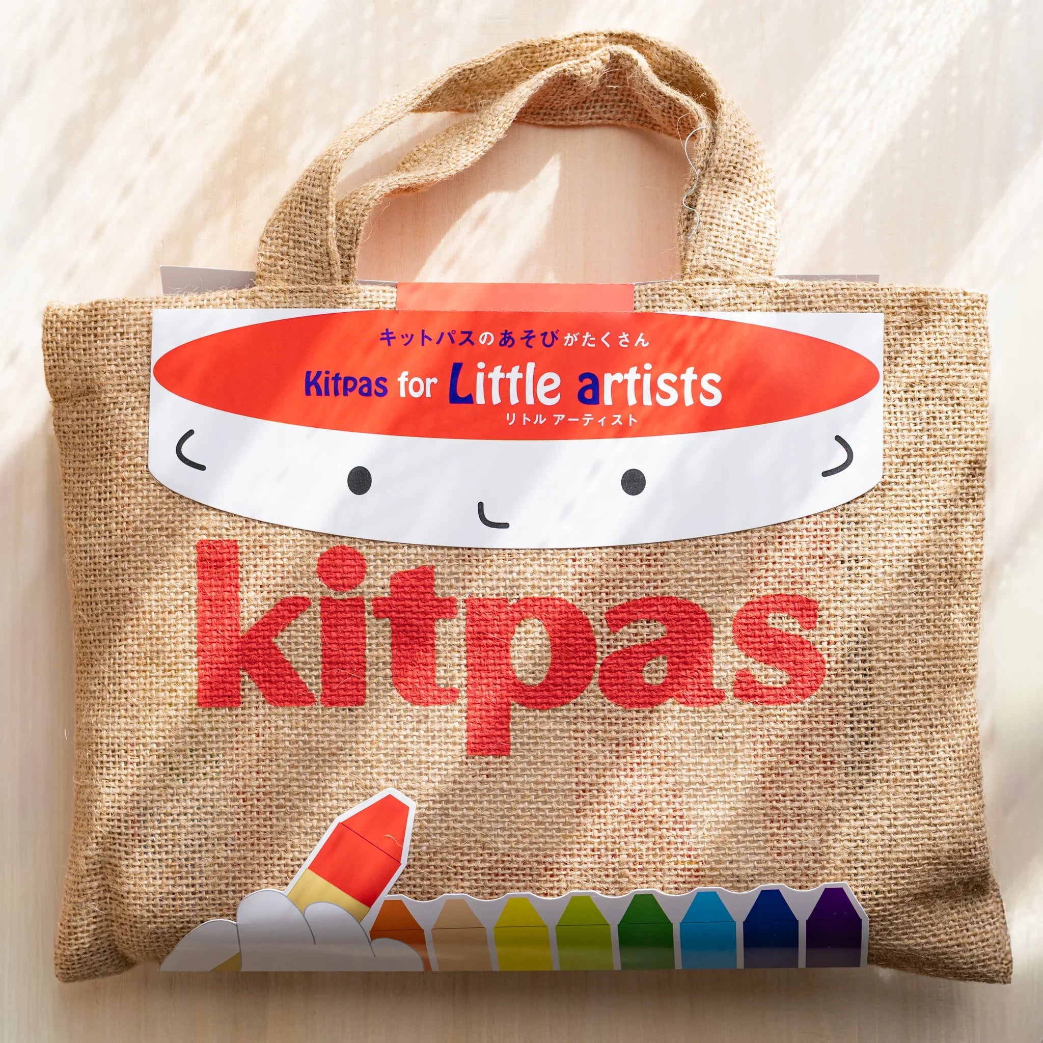 Set of Kitpas watercolor crayons with included water brush and sharpener accessories displayed together