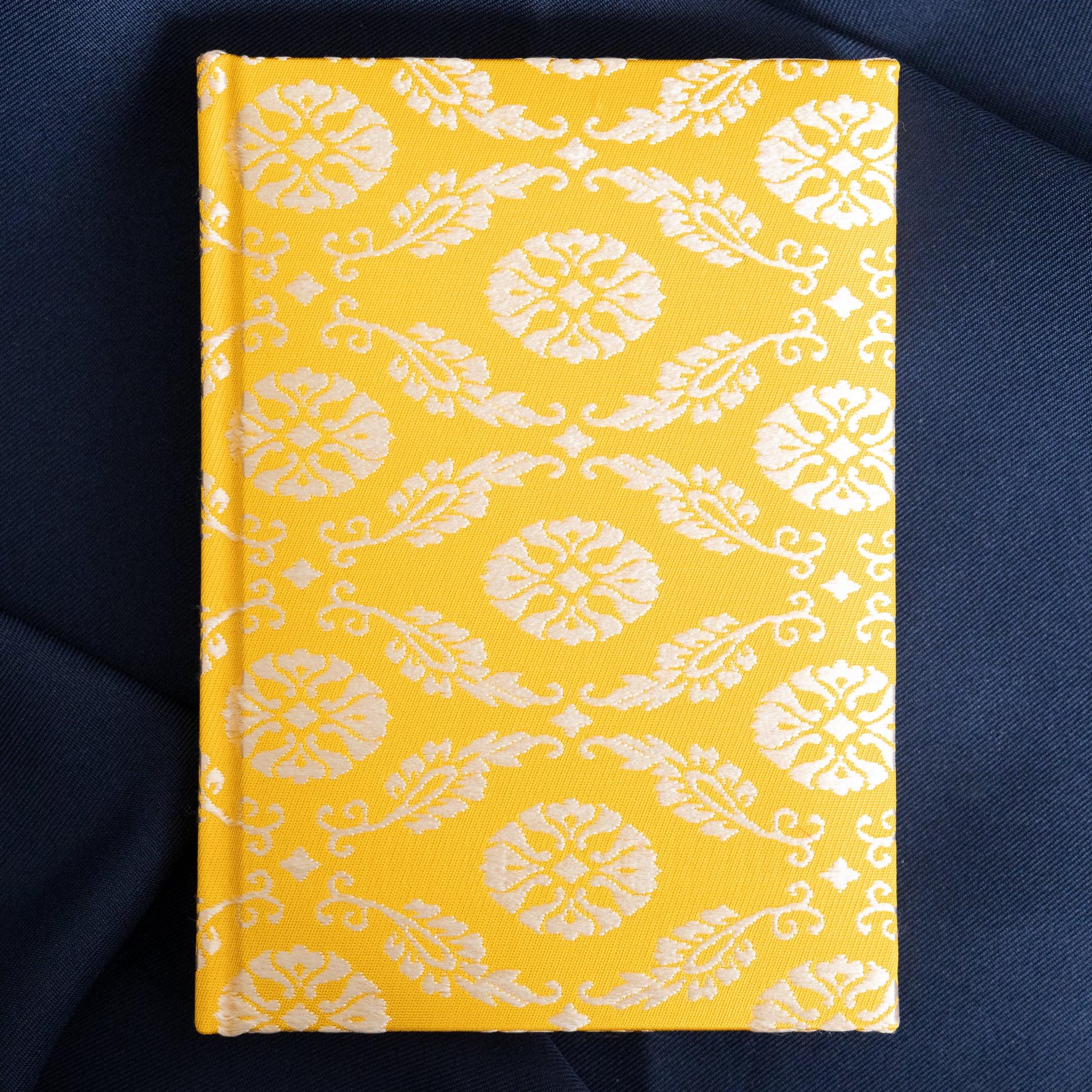 Ko Aoi Nishijin silk Homeicho notebook straight-on front cover without paper band showing full golden floral pattern on navy