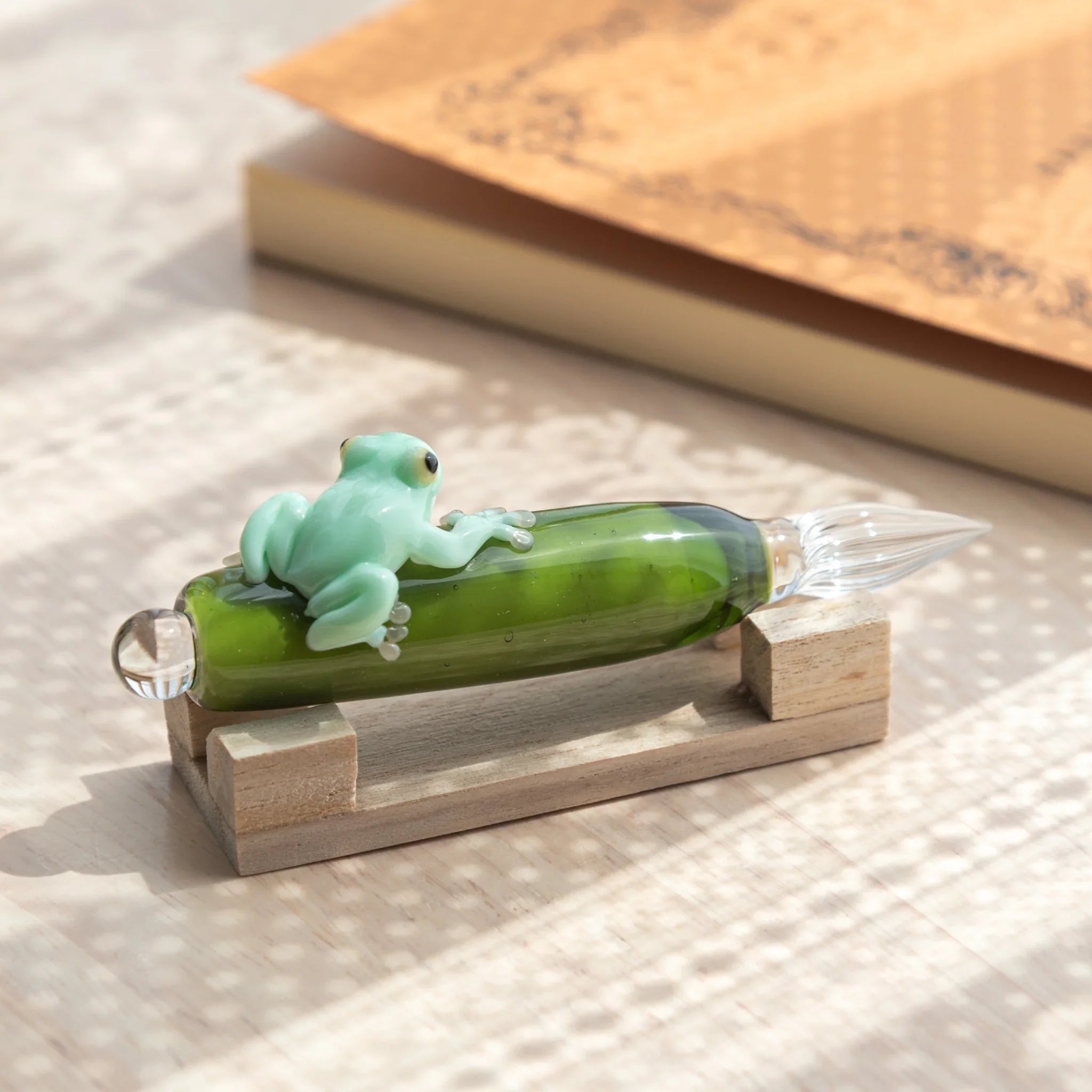 Japanese frog glass dip pen with hand-painted resin amphibian and hand-blown green glass ink bottle design