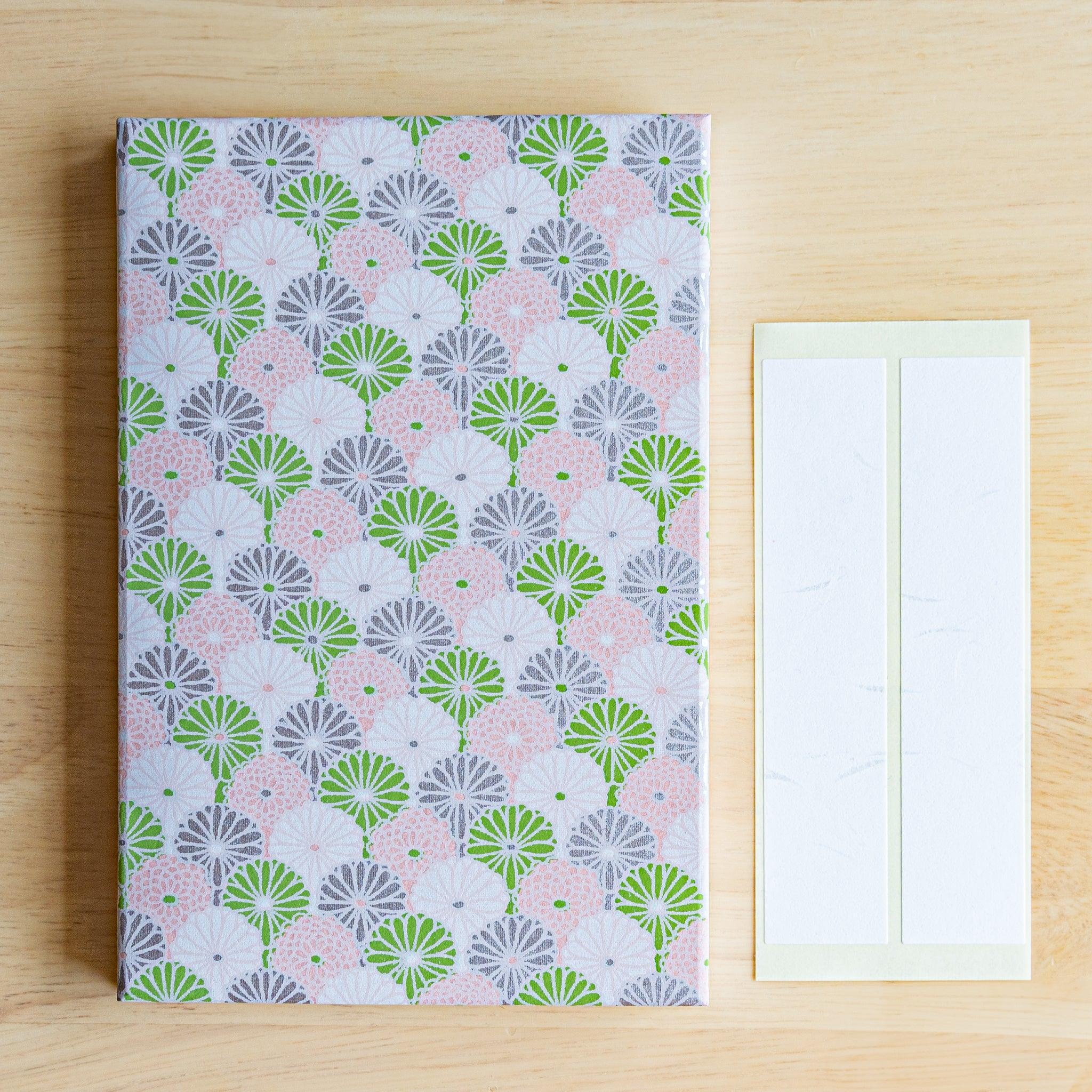 Chrysanthemum patterned Goshuinsho stamp book in soft lavender tones with label sheets. Made in Japan.
