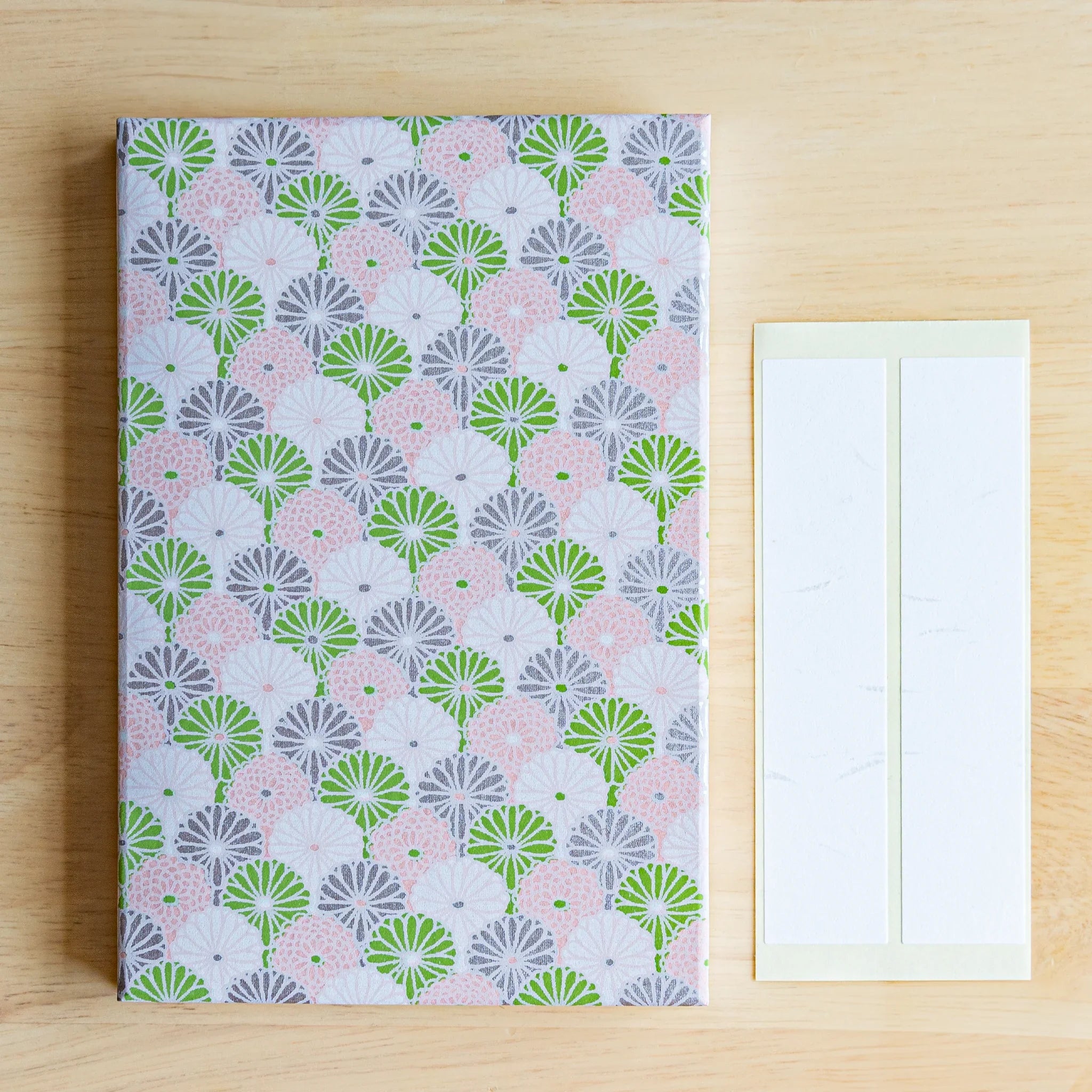 Lavender Mist Goshuincho open book display showing interior accordion folds and delicate flower pattern on washi