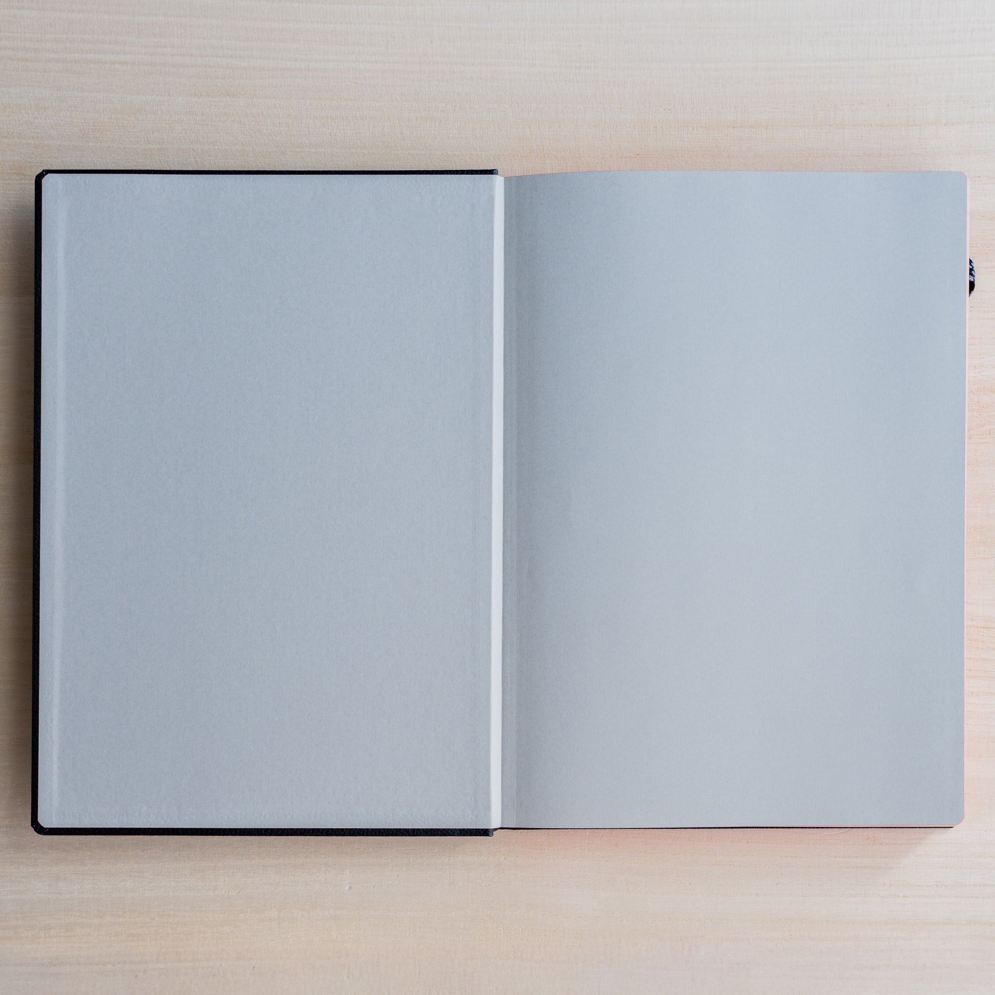 Life noble hard cover notebook A5 open flat showing blank cream L Writing Paper pages, smooth texture for fountain pens