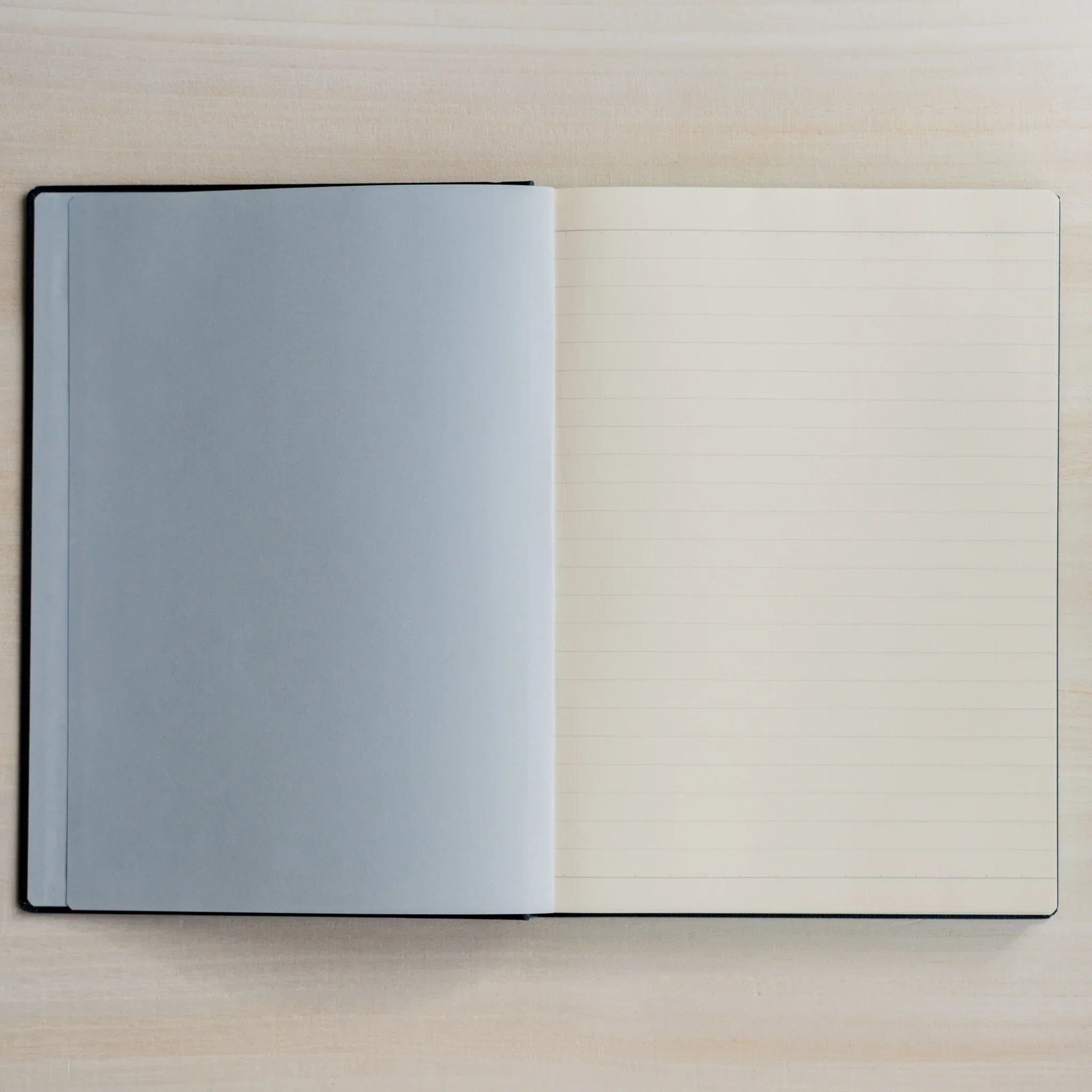 Life Noble A5 notebook featuring leather cover, open view showing highlighting spine visible, LIFE Japan A5 hardcover noteboo