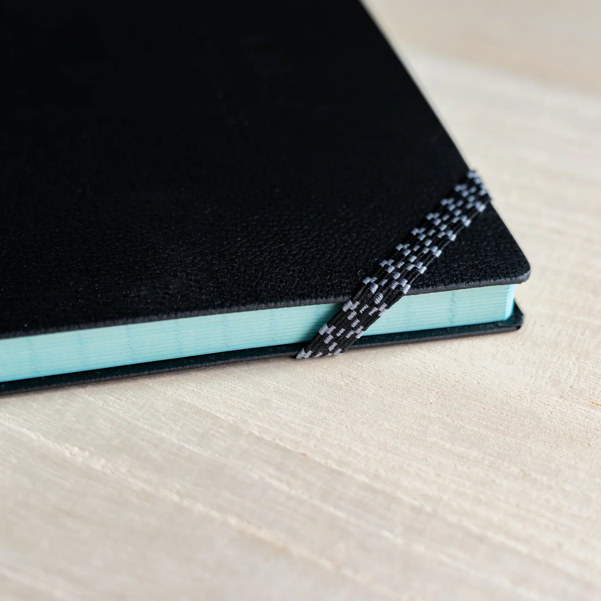 Life Noble A5 notebook, closed front cover leather cover showing spine visible, LIFE Japan A5 hardcover notebook with cream w