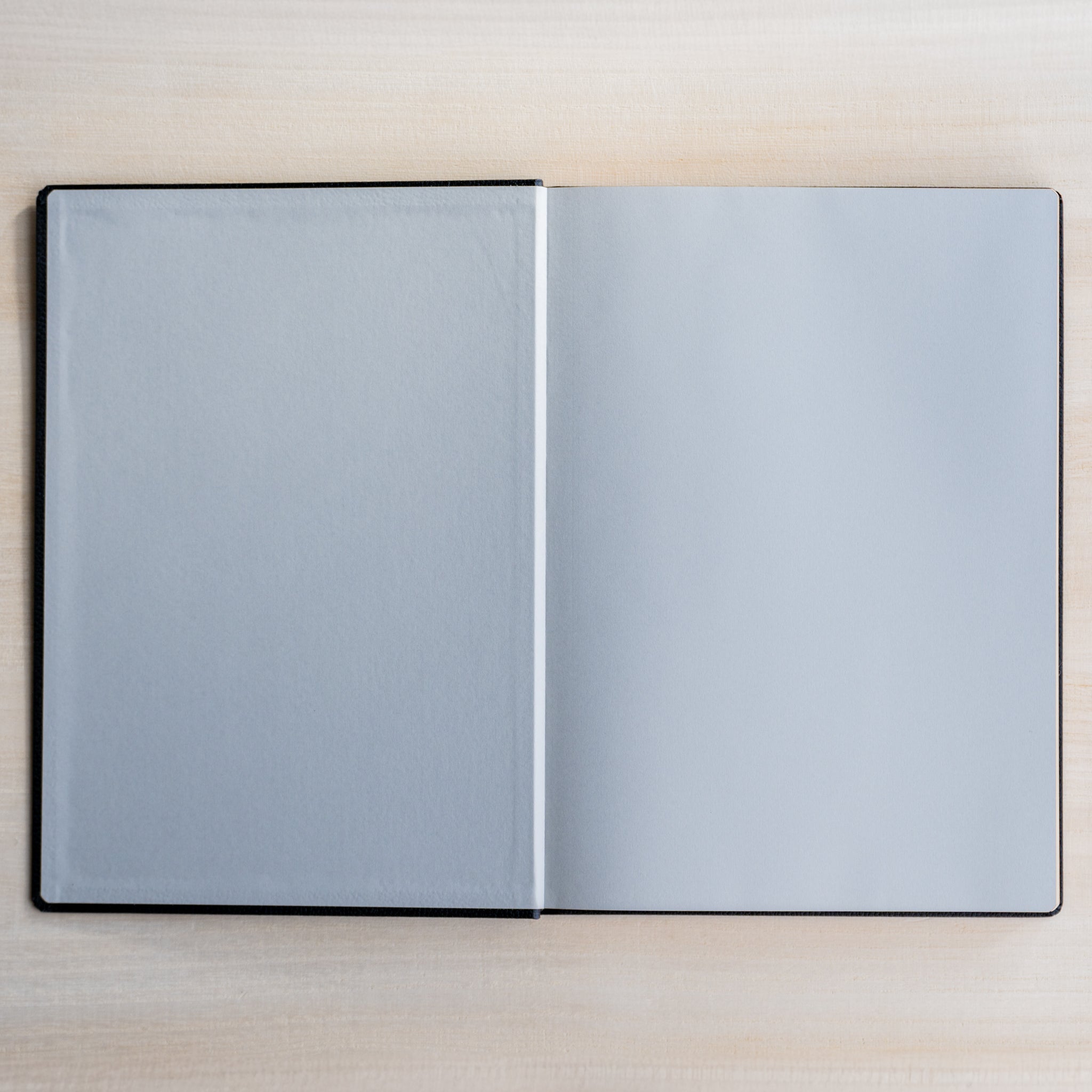 Life Noble notebook A5 hard cover open to blank pages, highlighting smooth cream paper for writing