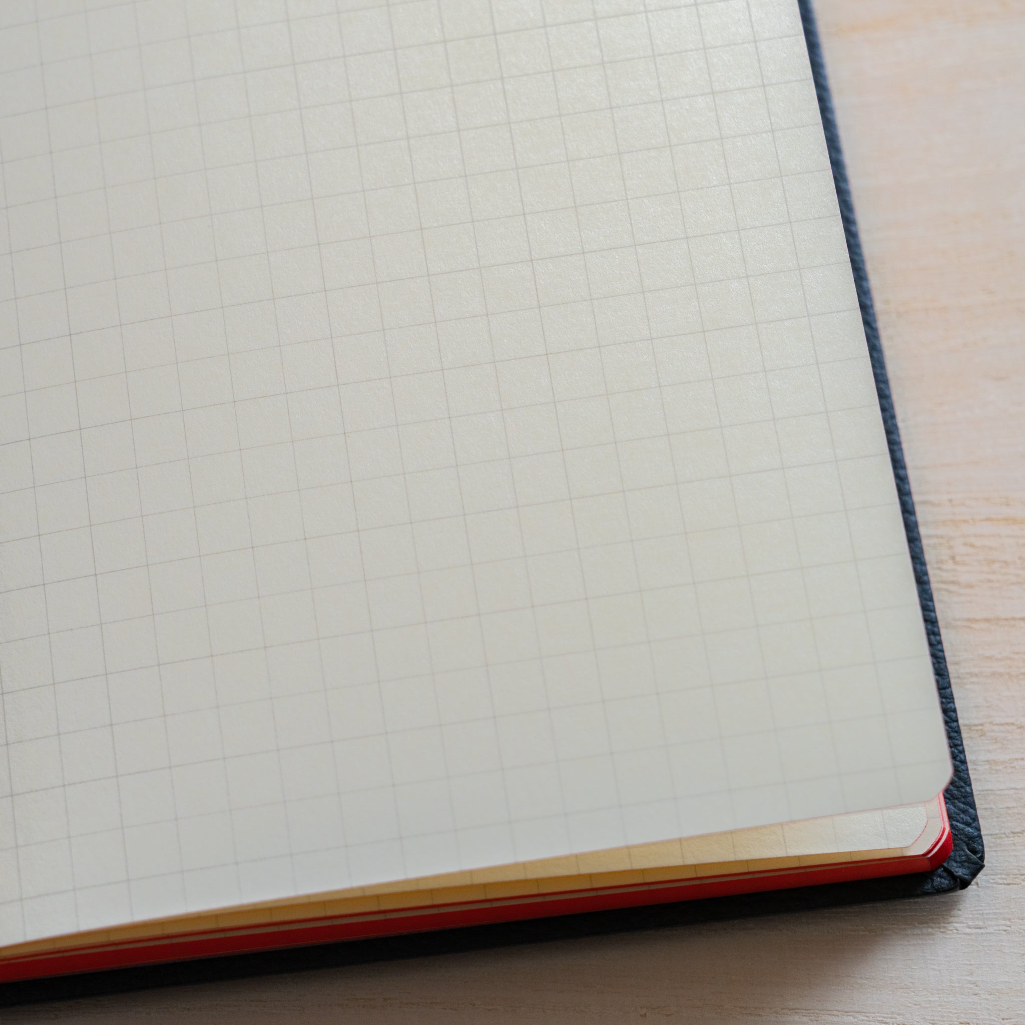 Life Noble notebook A6 close-up of grid L Writing Paper corner, showing neat layout, smooth cream paper, and refined binding