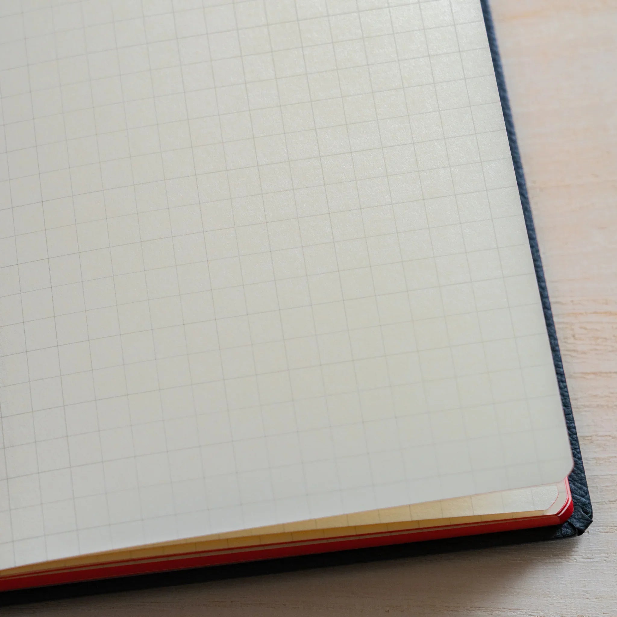 Life Noble A6 notebook, angled view showing quality materials with closure mechanism, LIFE Japan A6 hardcover notebook with c