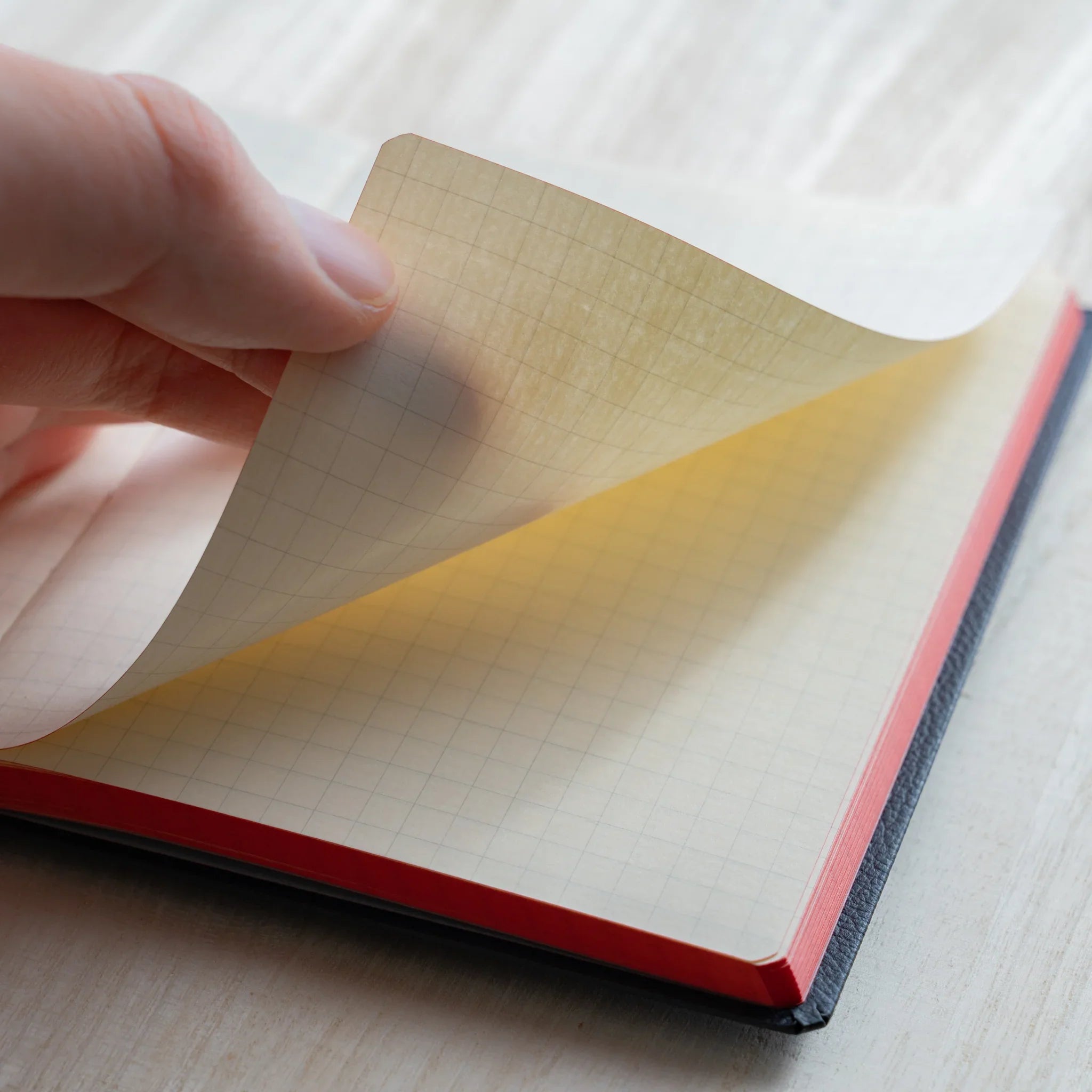 Life Noble A6 planning notebook featuring materials, angled view showing highlighting closure mechanism