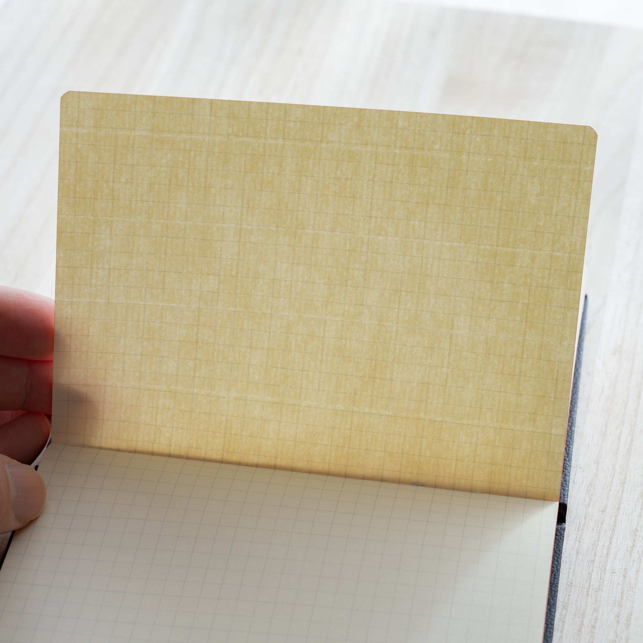 Life Noble notebook A6 open to grid L Writing Paper, showing smooth texture and refined Japanese paper quality
