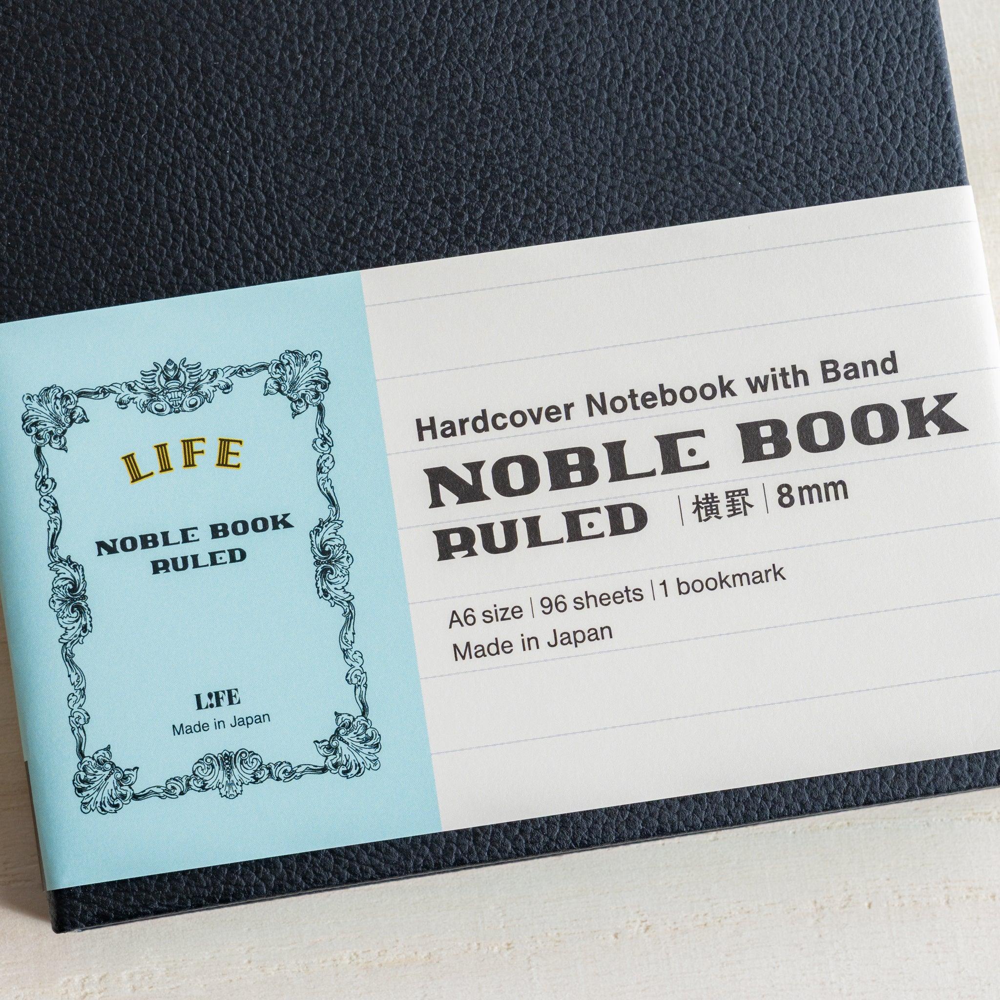 Life Noble A6 notebook, flat lay display decorative cover with spine visible, LIFE Japan A6 hardcover notebook with cream wri