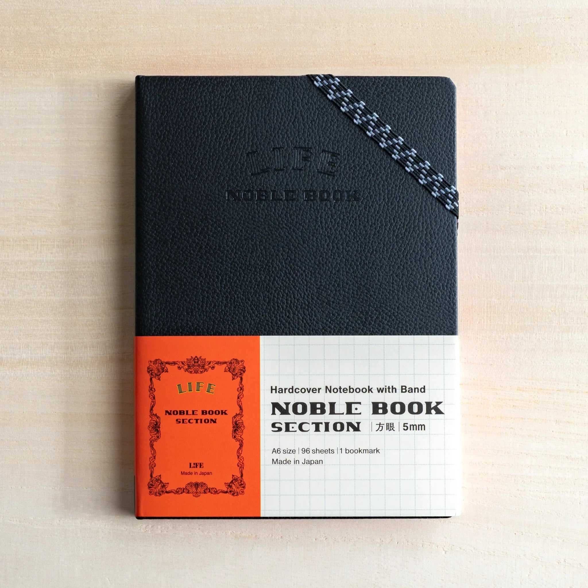 Life Noble A6 notebook featuring hardcover design, product photo highlighting closure mechanism, Japan