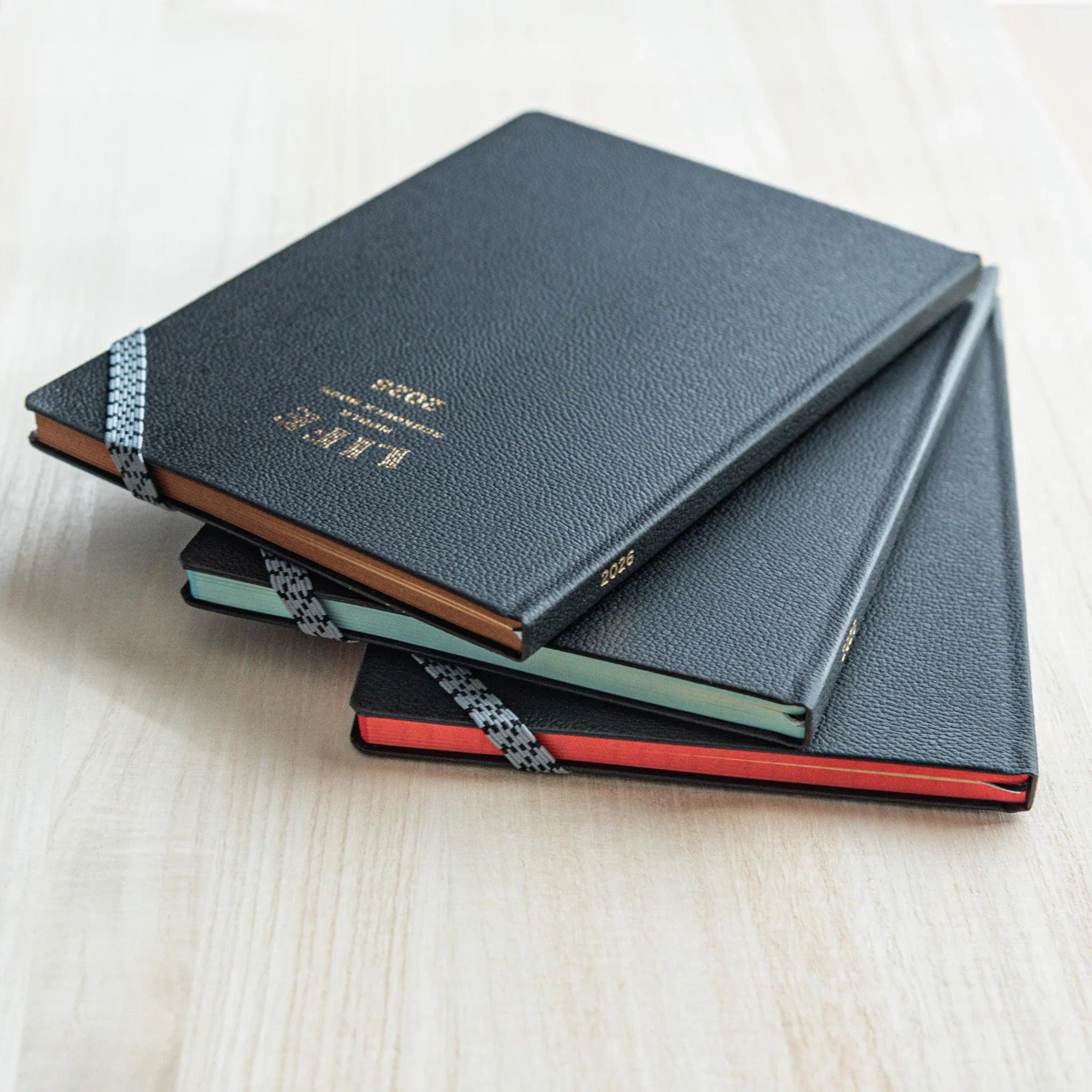 Life Noble 2026 schedule book featuring navy leather, full view display showing leather, Japanese LIFE brand hardcover planne